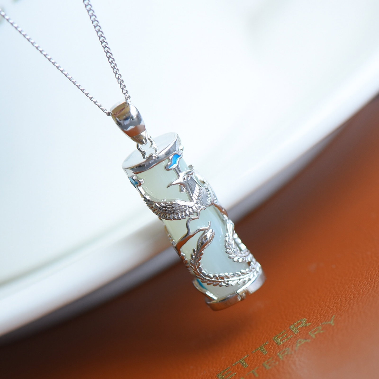 An Exquisite Sterling Silver Inlaid White Jade Pendant: An Exquisite Sterling Silver Inlaid White Jade Pendant,Size:7mmx23mm 纯银镶白玉吊坠