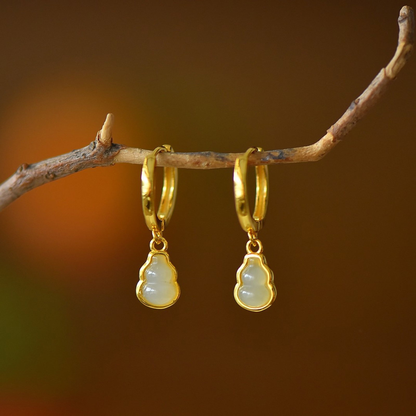 A Pair of Exquisite Sterling Silver-Gold Plated Inlaid White Jade Earrings: A Pair of Exquisite Sterling Silver-Gold Plated Inlaid White Jade Earrings 一对纯银镀金镶白玉耳环