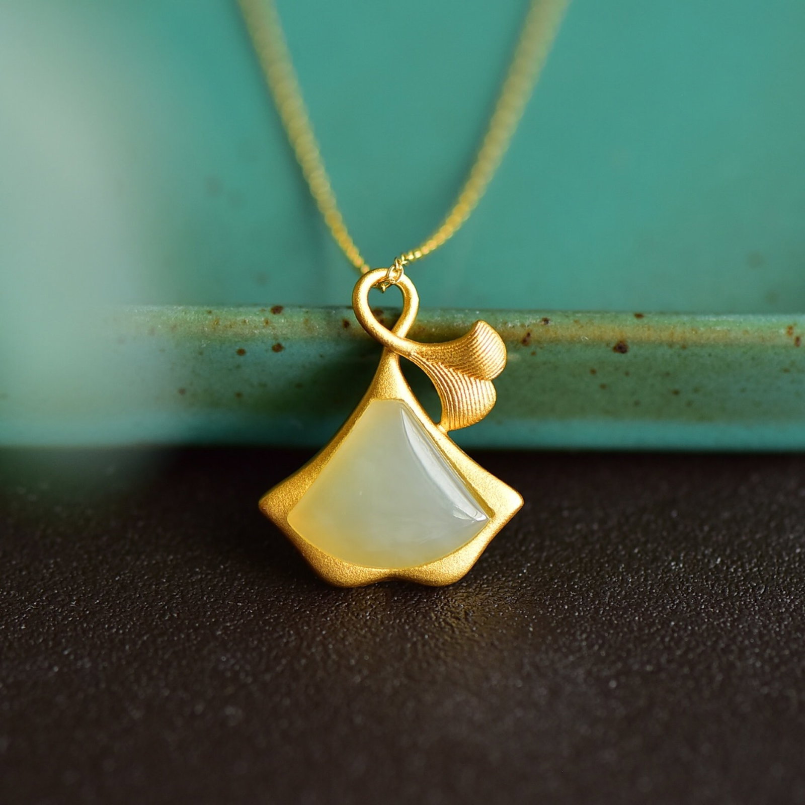 An Exquisite Sterling Silver-Gold Plated Inlaid White Jade Pendant: An Exquisite Sterling Silver-Gold Plated Inlaid White Jade Pendant 纯银镀金镶白玉吊坠