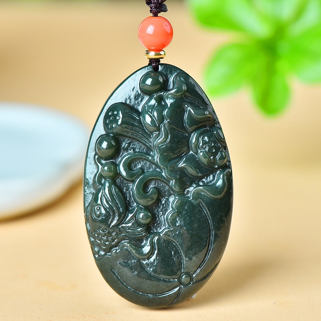 An Exquisite Sapphire Lotus and Fish Pattern Pendant: An Exquisite Sapphire Lotus and Fish Pattern Pendant,Size:34mmx56mm 寓意:温润细腻,干净完美 青玉莲花鱼纹&
