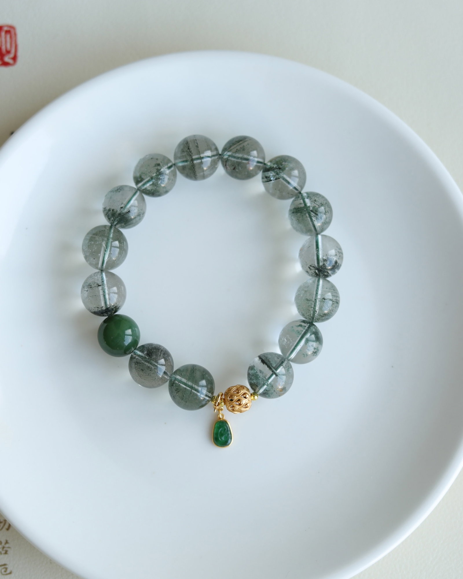 An Exquisite Crystal Bracelets,Inlaid Jadeite: An Exquisite Crystal Bracelets,Inlaid Jadeite,Size:13mm 水晶手串,嵌翡翠