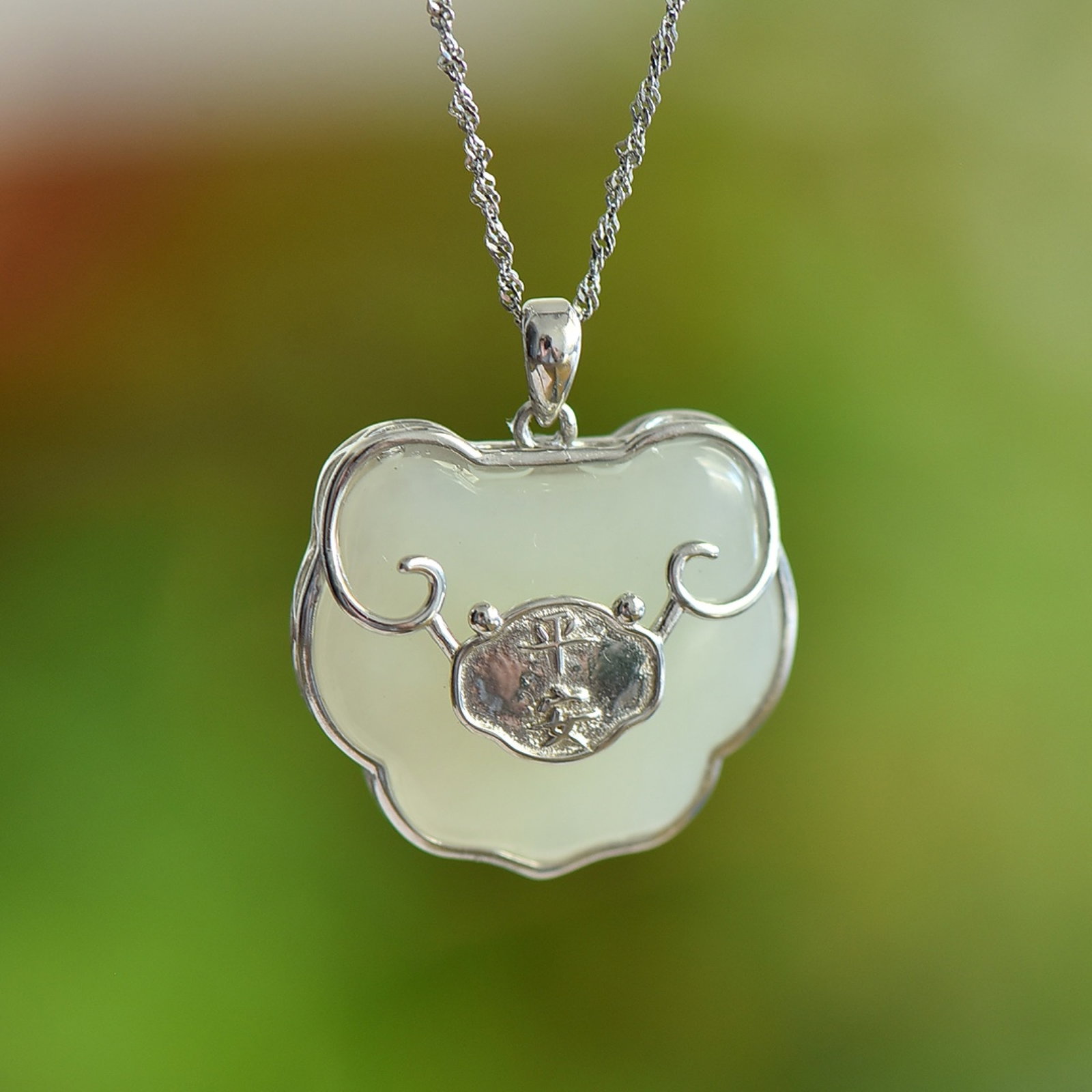 An Exquisite Sterling Silver Inlaid White Jade Pendant: An Exquisite Sterling Silver Inlaid White Jade Pendant,Size:22mmx25mm 纯银镶白玉吊坠