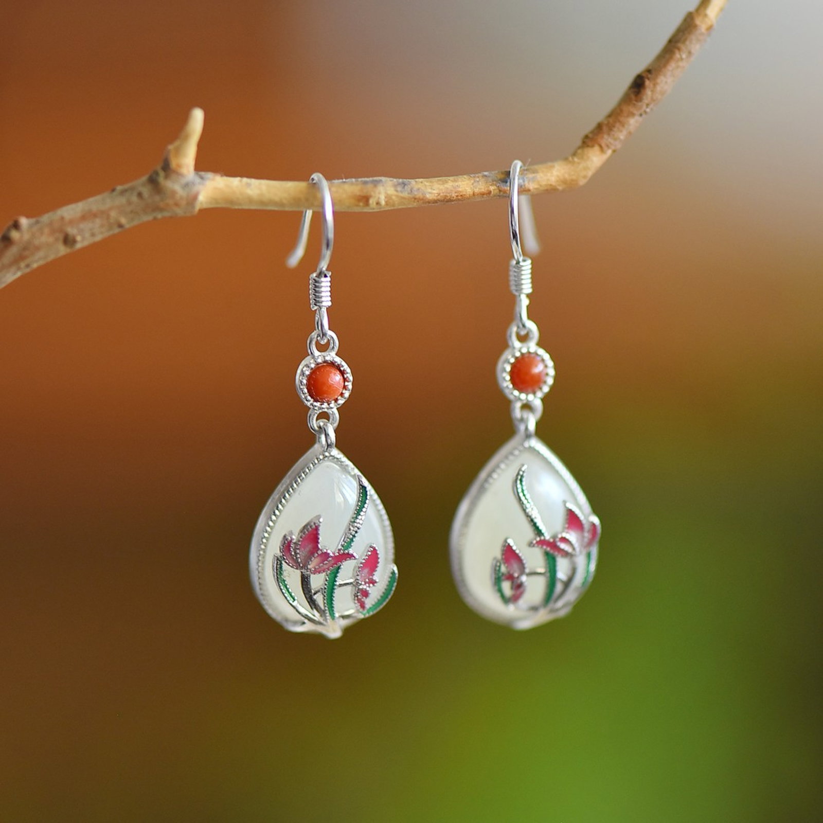 A Pair of Exquisite Sterling Silver Inlaid White Jade Earrings: A Pair of Exquisite Sterling Silver Inlaid White Jade Earrings,Size:10mmx14mm 一对纯银镶白玉耳环