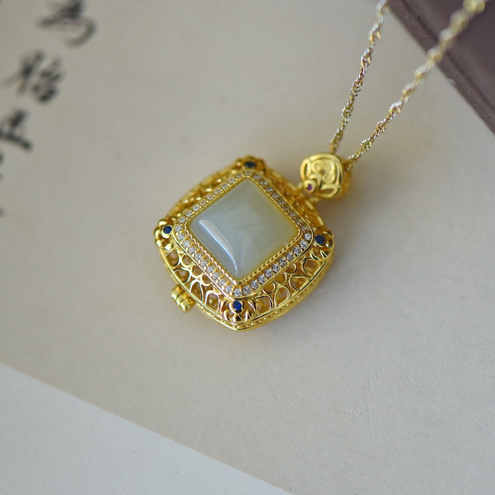 An Exquisite Sterling Silver-Gold Plated Inlaid White Jade Pendant: An Exquisite Sterling Silver-Gold Plated Inlaid White Jade Pendant,Size:10mmx10mm 纯银镀金镶白玉吊坠