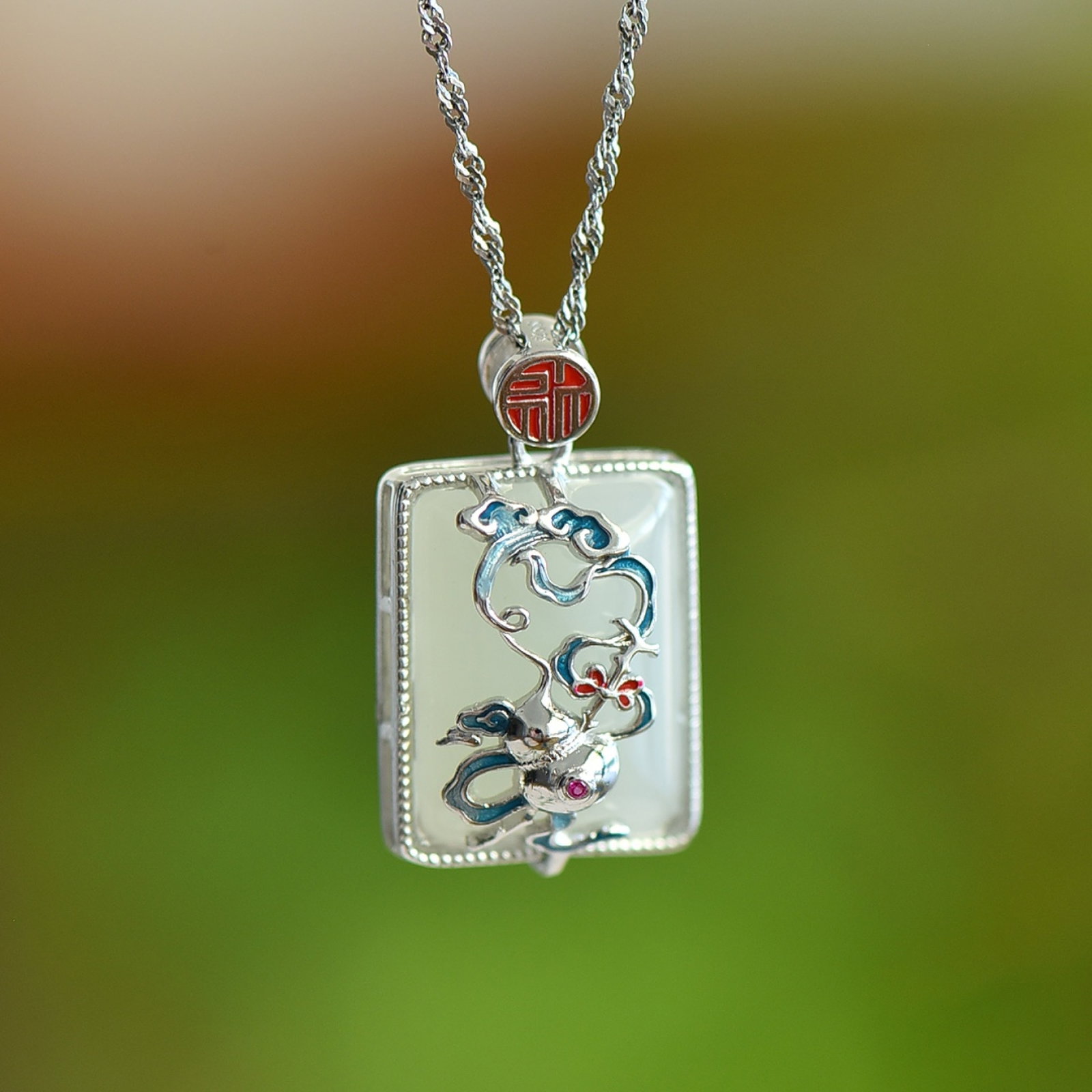 An Exquisite Sterling Silver Inlaid White Jade Enamel Pendant: An Exquisite Sterling Silver Inlaid White Jade Enamel Pendant,Size:12mmx16mm 纯银镶白玉珐琅吊坠