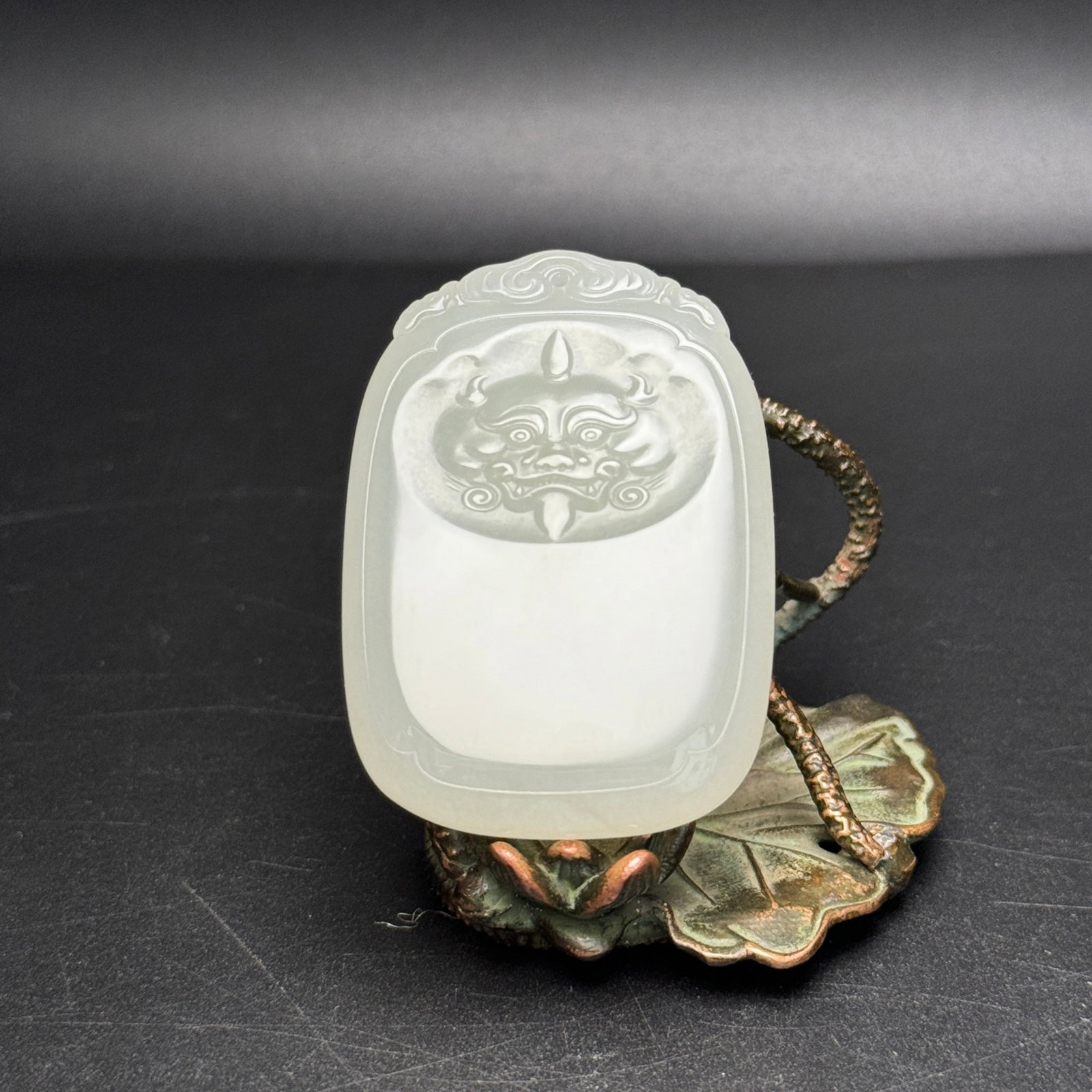 An Exquisite White Jade Beast-Face Pattern Pendant: An Exquisite White Jade Beast-Face Pattern Pendant,Qing Dynasty,China,Size:36mmx52mmx9mm,Weight:38g 白玉兽面纹挂件,中国清代