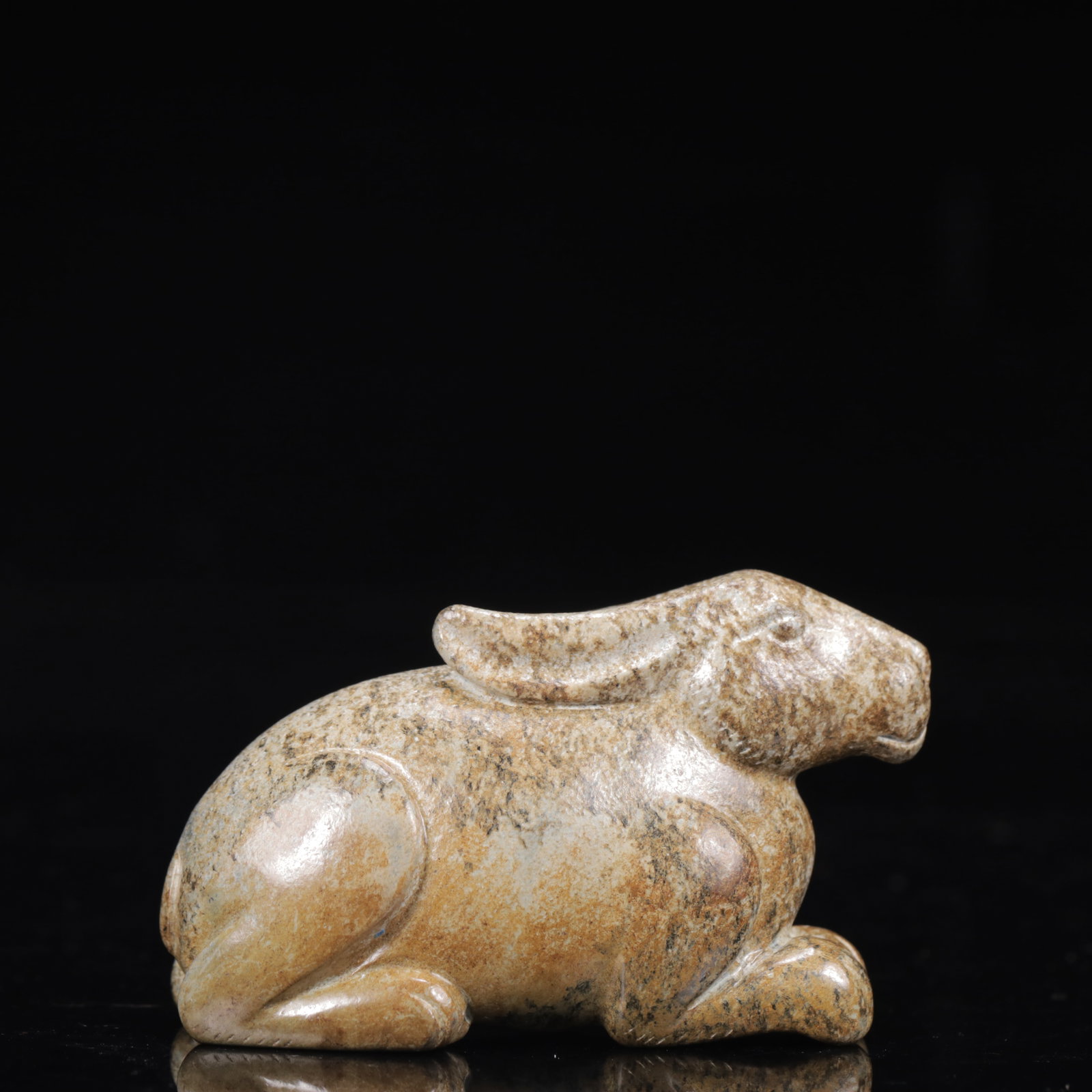 An Exquisite Greenish Jade Rabbit Ornament: An Exquisite Greenish Jade Rabbit Ornament,Qing Dynasty,China,Size:2.8inx1.2inx1.6in,Weight:141g 青白玉兔摆件,中国清代