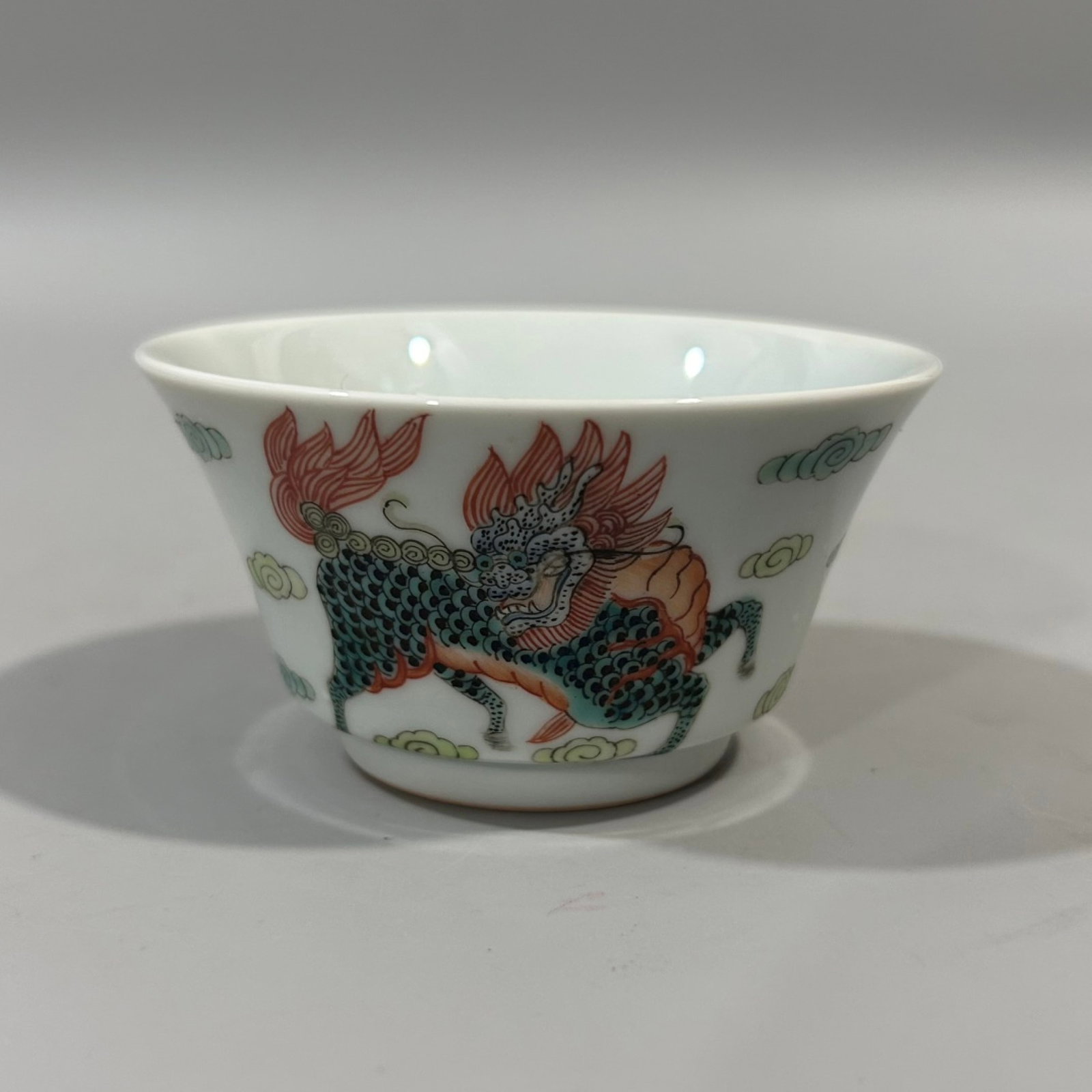 An Exquisite Famille-Rose Auspicious Cloud and Kylin Pattern Cup: An Exquisite Famille-Rose Auspicious Cloud and Kylin Pattern Cup,Qing Dynasty,China,Tongzhi Four-character Mark,Size:3.1inx1.8in