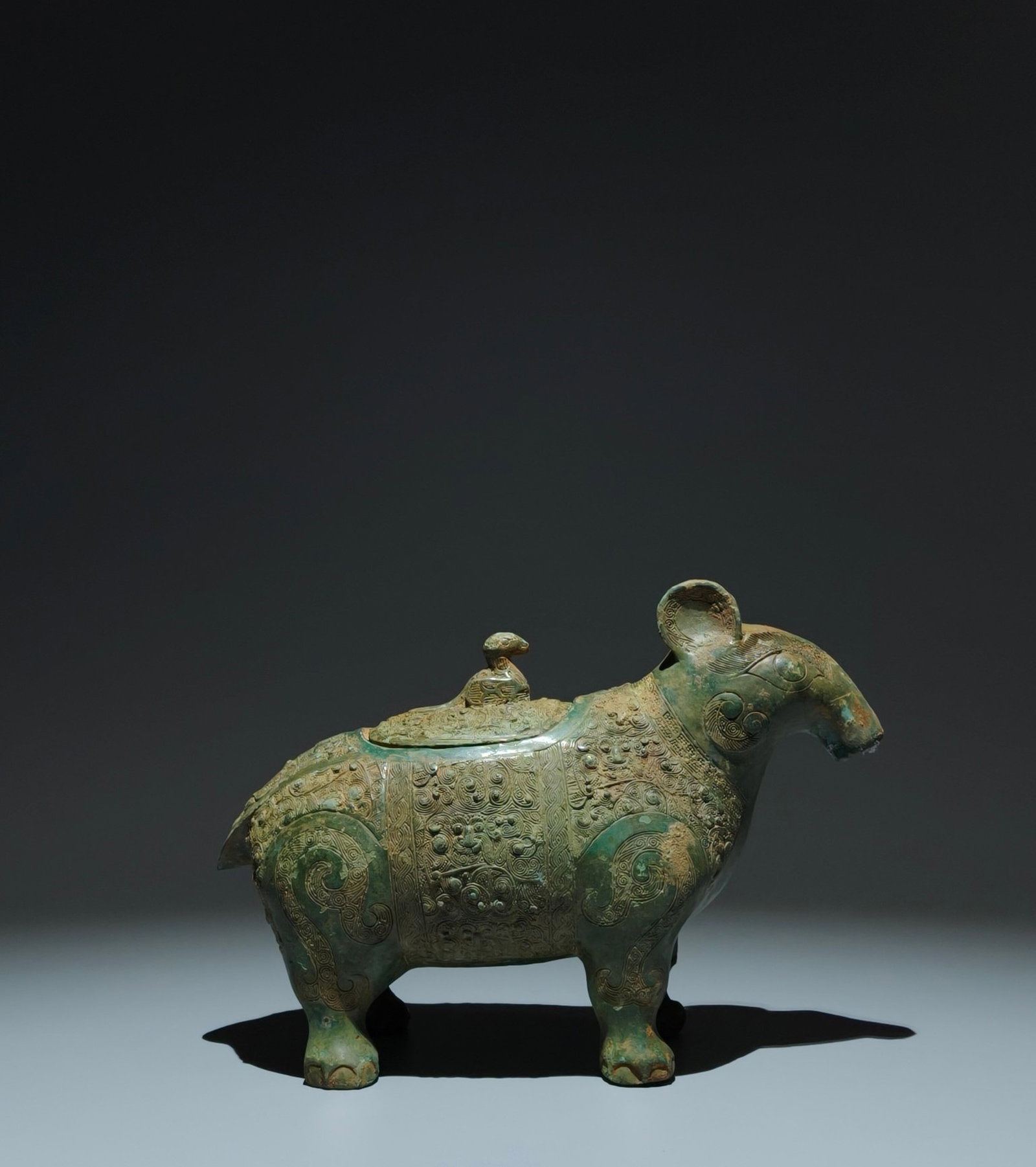 An Archaic Bronze Feather Pattern Beast-Shaped Food Vessel,With Inscription: An Archaic Bronze Feather Pattern Beast-Shaped Food Vessel,With Inscription,the Warring States period in China,Size:6.5inx9.3inx3.7in