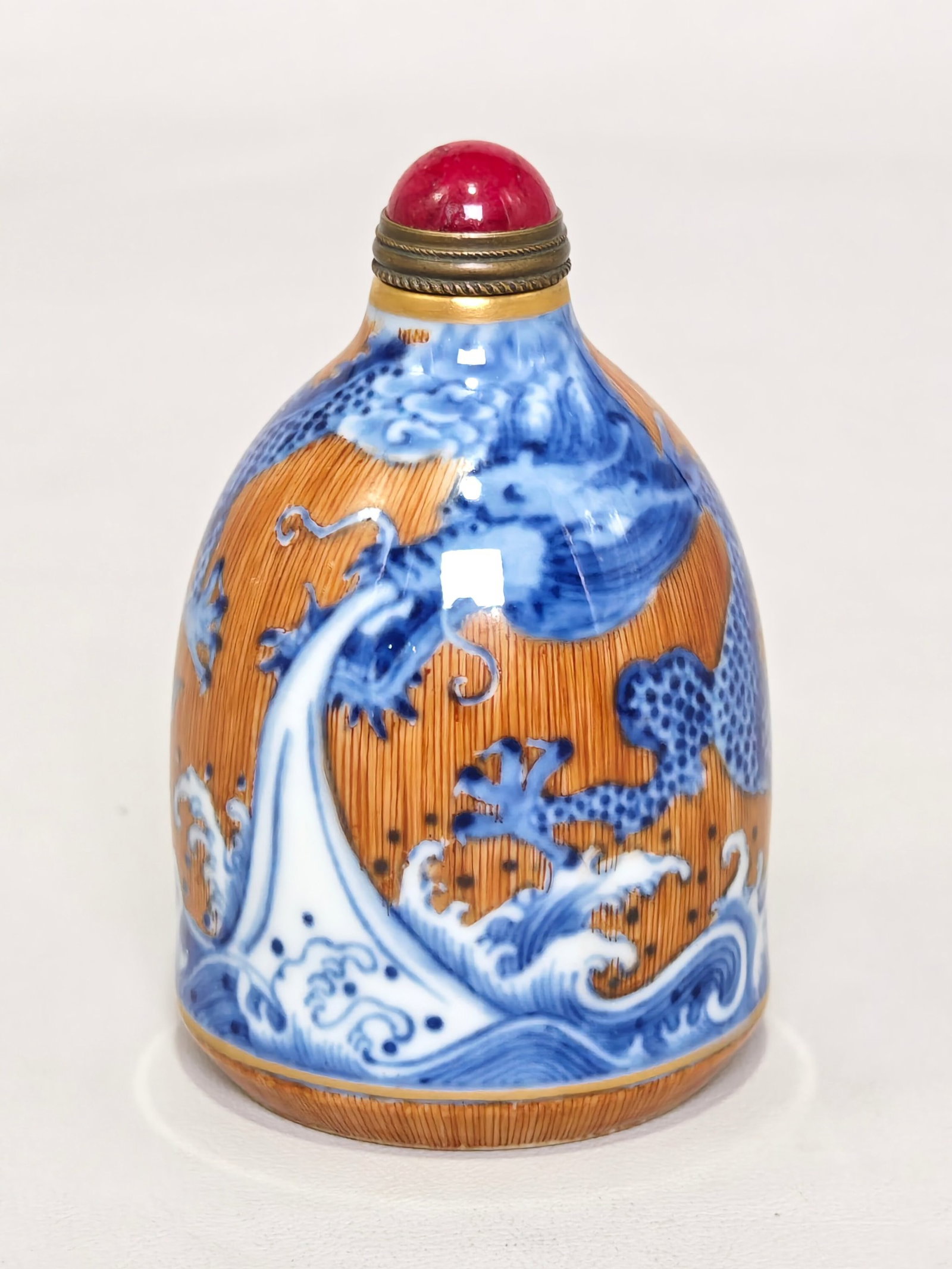 An Exquisite Blue and White Brown Glazed Seawater Dragon Pattern Snuff Bottle: An Exquisite Blue and White Brown Glazed Seawater Dragon Pattern Snuff Bottle,Qing Dynasty,China,Qianlong Four-character Mark,Size:3inx1.9in 青花褐釉海水龙
