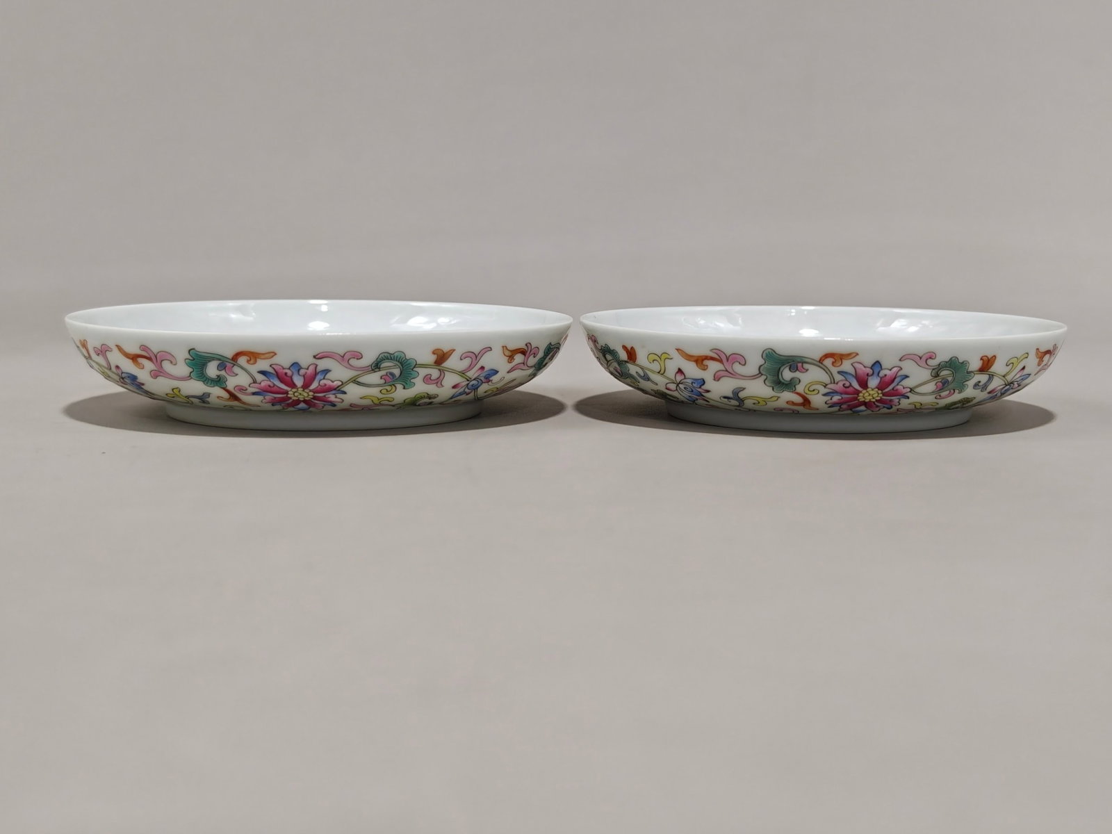 A Pair of Exquisite Famille-Rose Lotus Pattern Plates: A Pair of Exquisite Famille-Rose Lotus Pattern Plates,Qing Dynasty,China,Yongzheng Four-character Mark,Size:0.9inx4.9in 一对粉彩缠枝莲纹盘,中