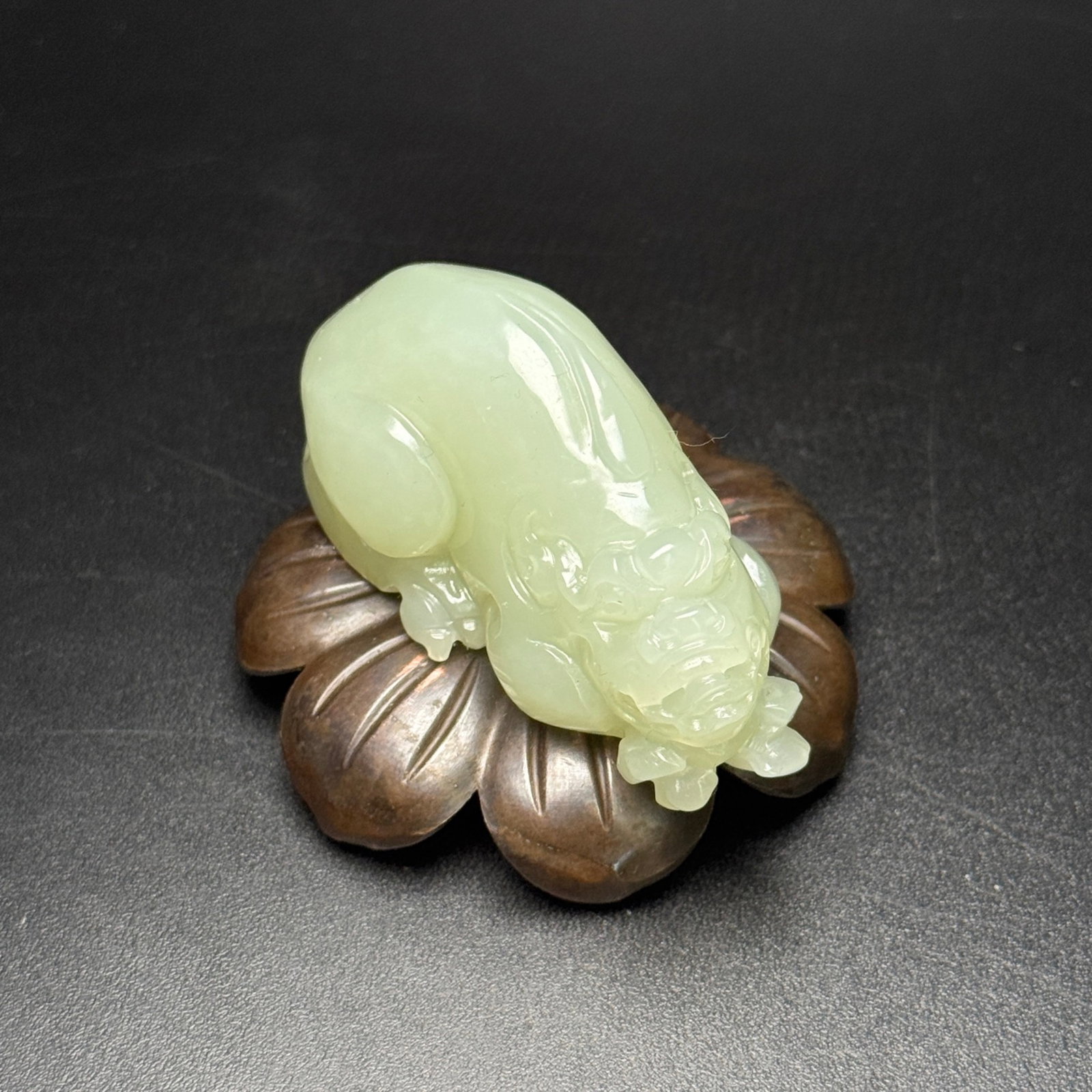 An Exquisite White Jade Auspicious Beast Hand Piece: An Exquisite White Jade Auspicious Beast Hand Piece,Qing Dynasty,China,Size:64mmx30mmx32mm,Weight:78g 白玉瑞兽手把件,中国清代