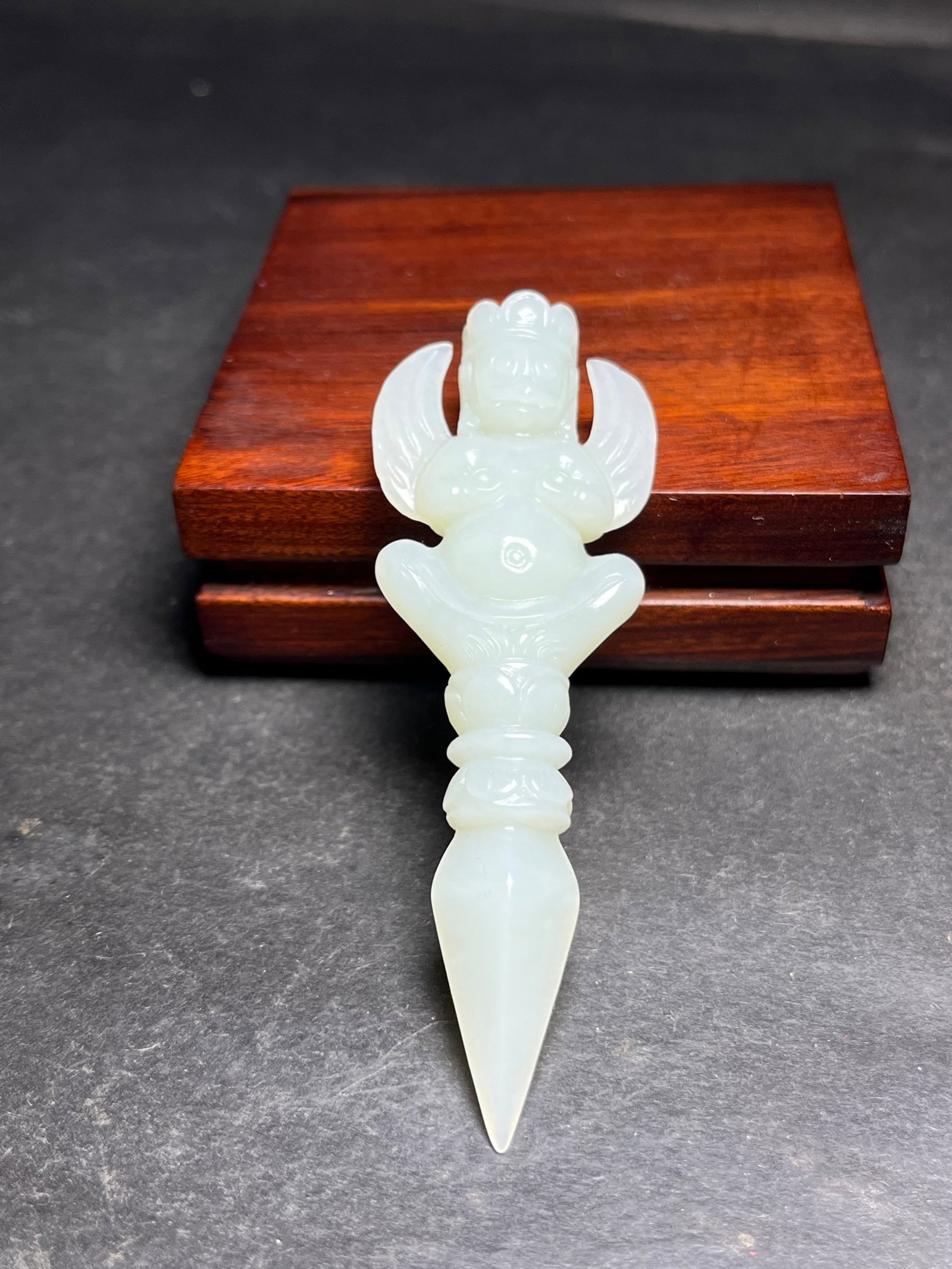An Exquisite White Jade Buddha-Face Pattern Vajry Pestle: An Exquisite White Jade Buddha-Face Pattern Vajry Pestle,Qing Dynasty,China,Size:88mmx14mmx30mm,Weight:25g 白玉佛面纹金刚杵,中国清