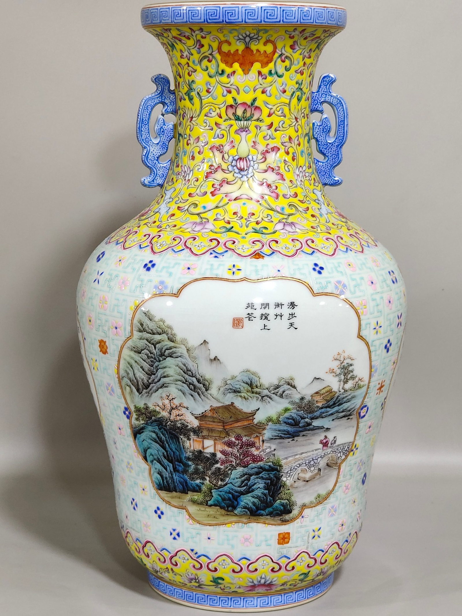A Rare Yellow Ground Famille-Rose Painted Gold Landscape and Figure Pattern Double-Ears Vase,With: A Rare Yellow Ground Famille-Rose Painted Gold Landscape and Figure Pattern Double-Ears Vase,With Poem,Qing Dynasty,China,Qianlong Six-character Mark,Size:12.7inx6.9in 黄地粉彩