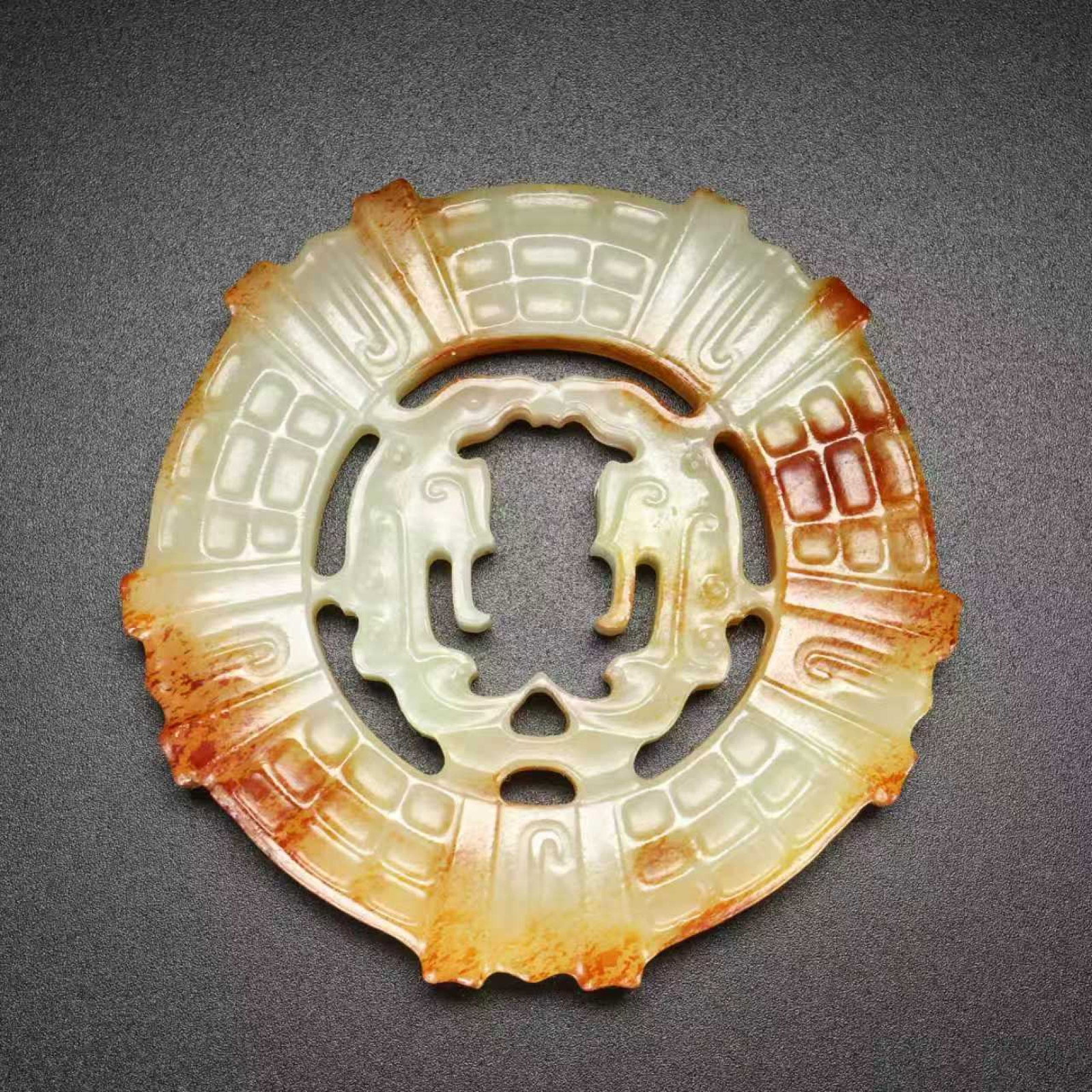 An Exquisite White Jade Auspicious Beast Pattern Pendant: An Exquisite White Jade Auspicious Beast Pattern Pendant,Qing Dynasty,China,Size:2.4inx2.4inx0.3in,Weight:54g 白玉瑞兽纹挂件,中国清代