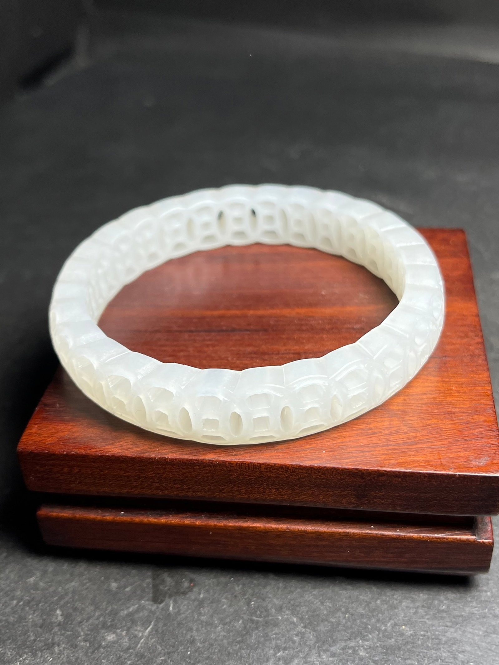 An Exquisite White Jade Hollow Cash Pattern Bracelets: An Exquisite White Jade Hollow Cash Pattern Bracelets,Qing Dynasty,China,Size:60mmx12mm,Weight:31g 白玉镂空铜钱纹手镯,中国清