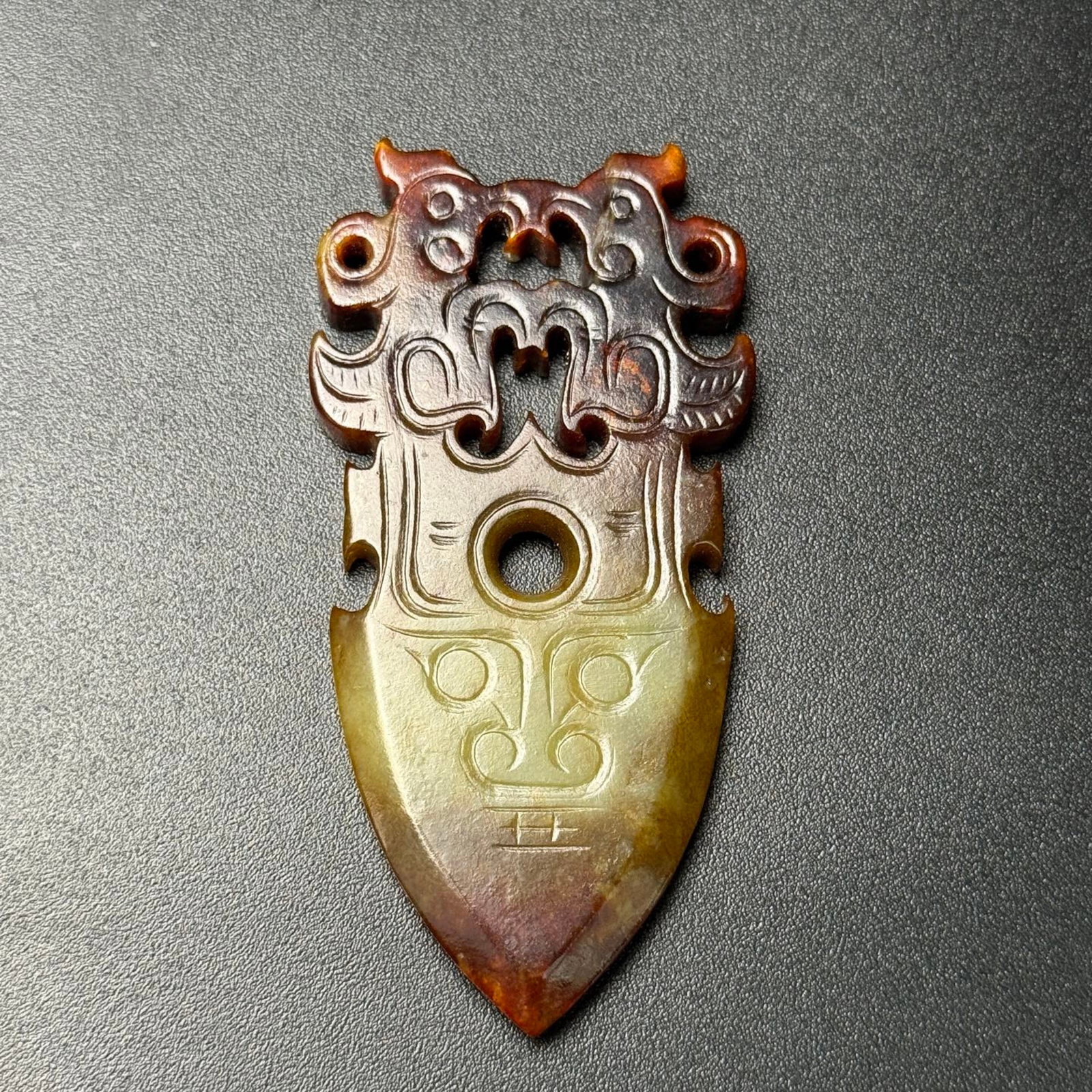 An Exquisite White Jade Beast-Face and Phoenix Pattern Pendant: An Exquisite White Jade Beast-Face and Phoenix Pattern Pendant,Qing Dynasty,China,Size:83mmx41mmx6mm,Weight:38g 白玉兽面凤纹挂件,中国清