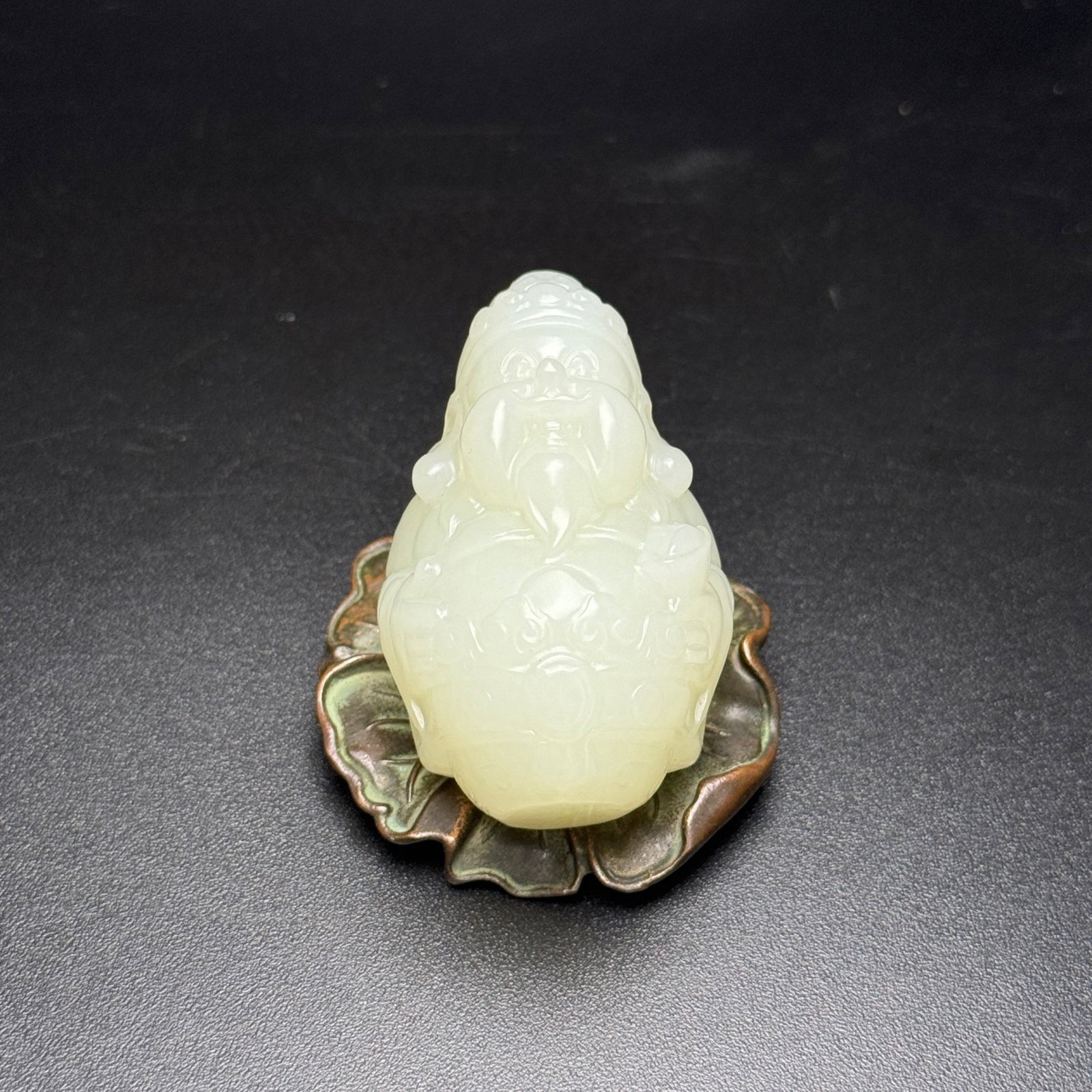 An Exquisite White Jade Statue of Mammon Hand Piece: An Exquisite White Jade Statue of Mammon Hand Piece,Qing Dynasty,China,Size:56mmx35mmx30mm,Weight:80g 白玉财神像手把件,中国清代