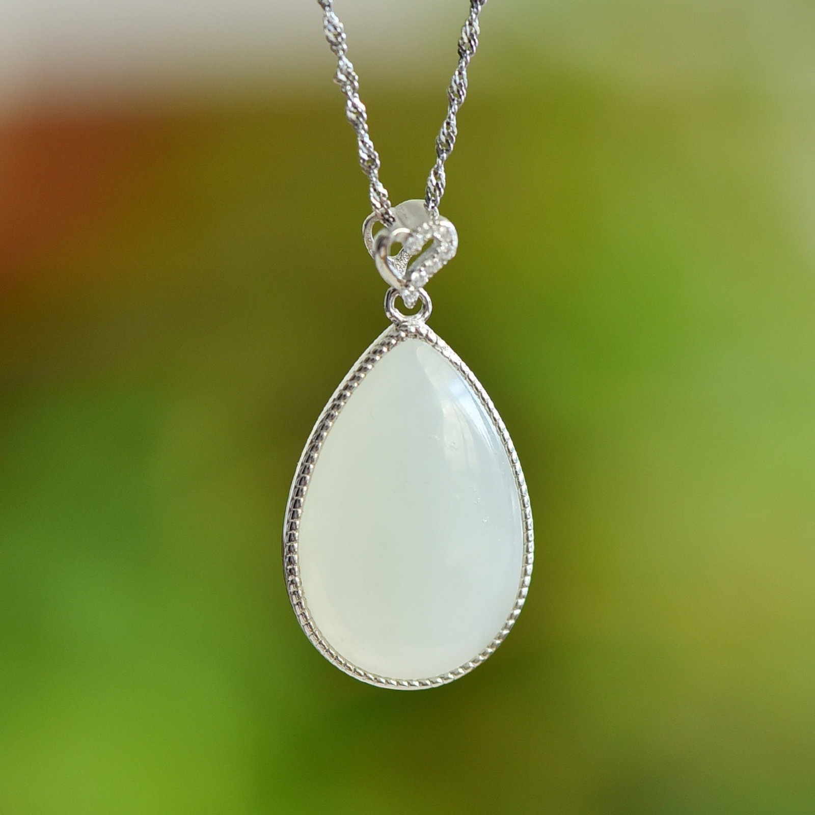 An Exquisite Sterling Silver Inlaid White Jade Pendant: An Exquisite Sterling Silver Inlaid White Jade Pendant,Size:15mmx23mm 纯银镶白玉吊坠