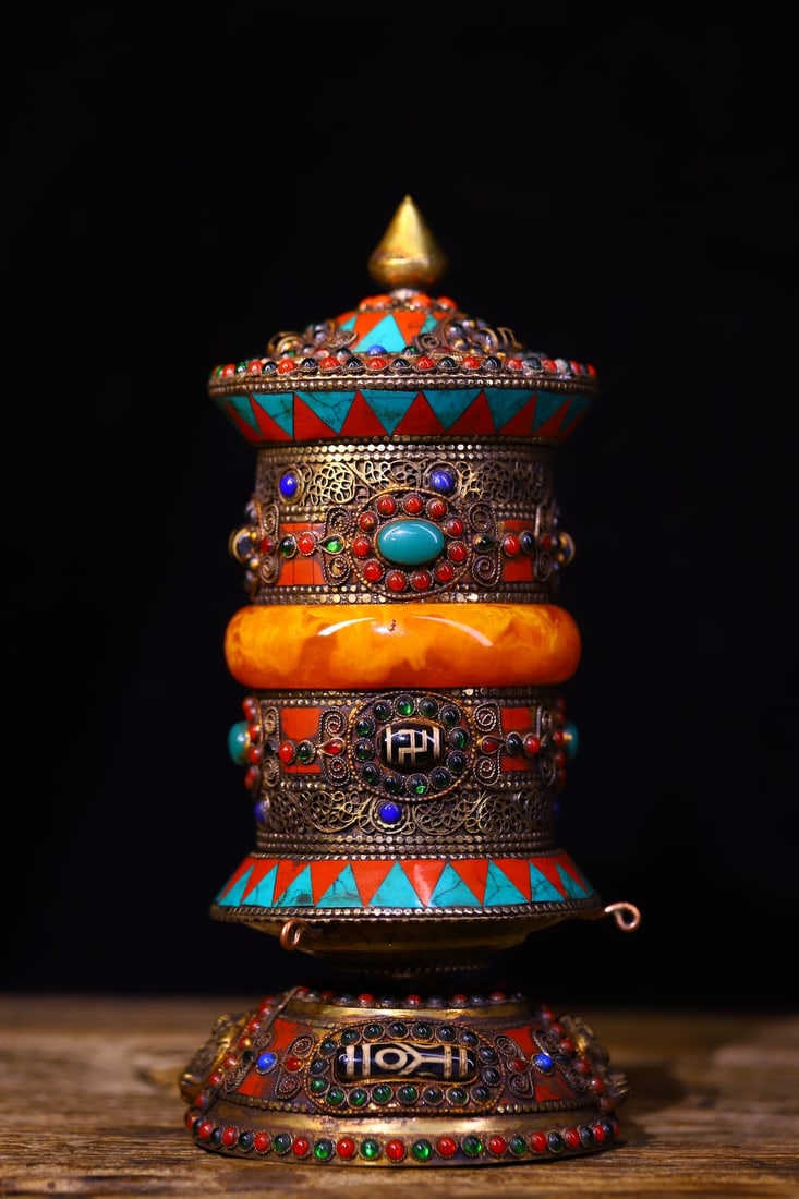 An Exquisite Silver Inlaid Gems Dzi Bead With Sanskrit Ornament: An Exquisite Silver Inlaid Gems Dzi Bead With Sanskrit Ornament Qing Dynasty, China Size:8.7inx3.7in Weight:600g银嵌宝石天珠转经轮 中国