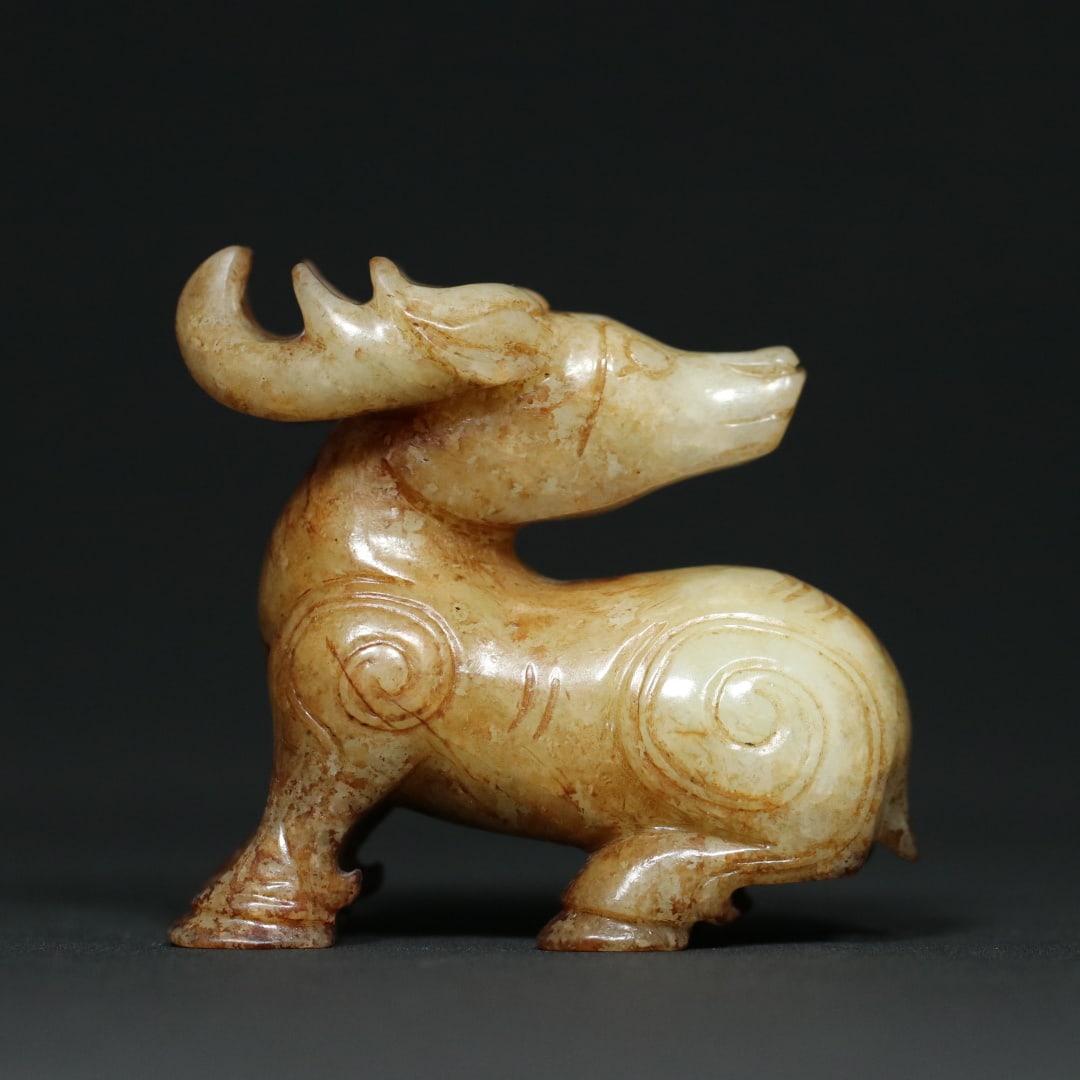 An Exquisite White Jade Deer Ornament: An Exquisite White Jade Deer Ornament W.Zhou , China Size:2.4inx1.2inx2.3in Weight:119.5g白玉玉鹿摆件 西周时期 Size:6.2cmx3cmx5.8cm Weight:1