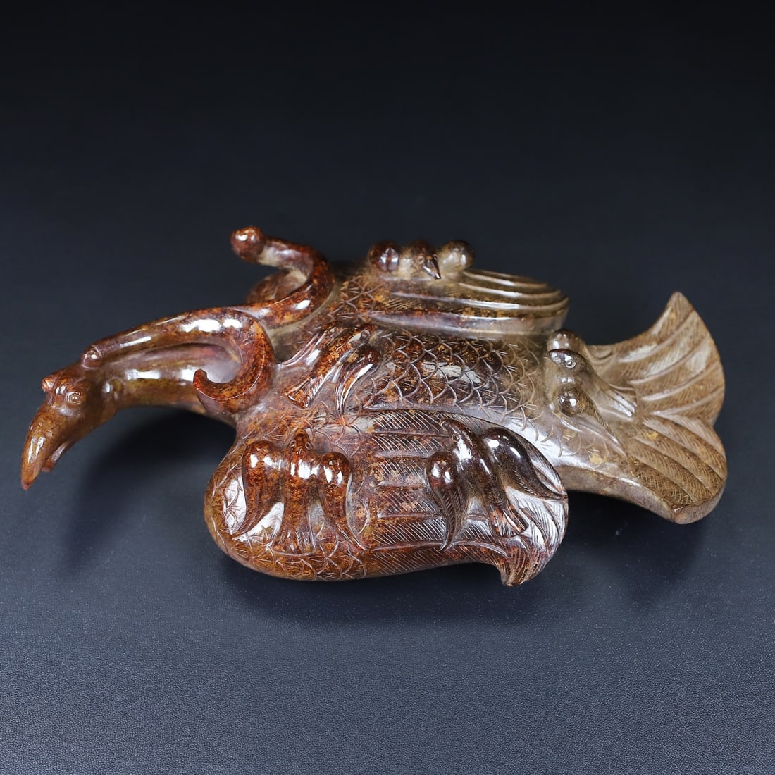An Exquisite White Jade Phoenix Ornament: An Exquisite White Jade Phoenix Ornament Han Dynasty, China Size:7.6inx4.2inx1.9in Weight:759g白玉凤鸟 中国汉代 Size:19.2cmx10.6cmx4.8cm Weight:759g