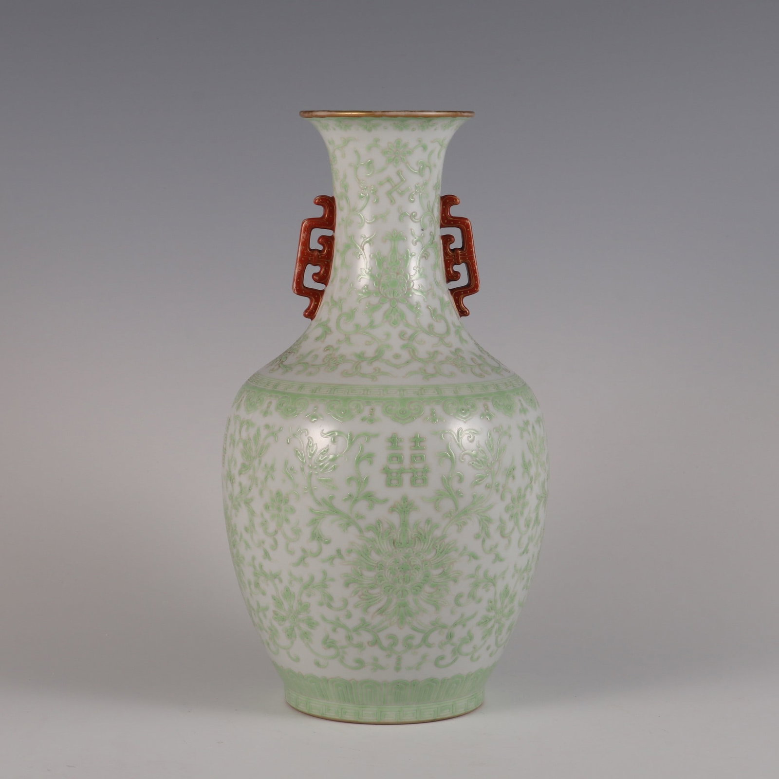 An Exquisite Green Ground Lotus Pattern Double-Ears Vase: An Exquisite Green Ground Lotus Pattern Double-Ears Vase Qing Dynasty, China Daoguang Six-character Mark Size:11.7inx5.9in绿彩缠枝莲囍字纹双೑
