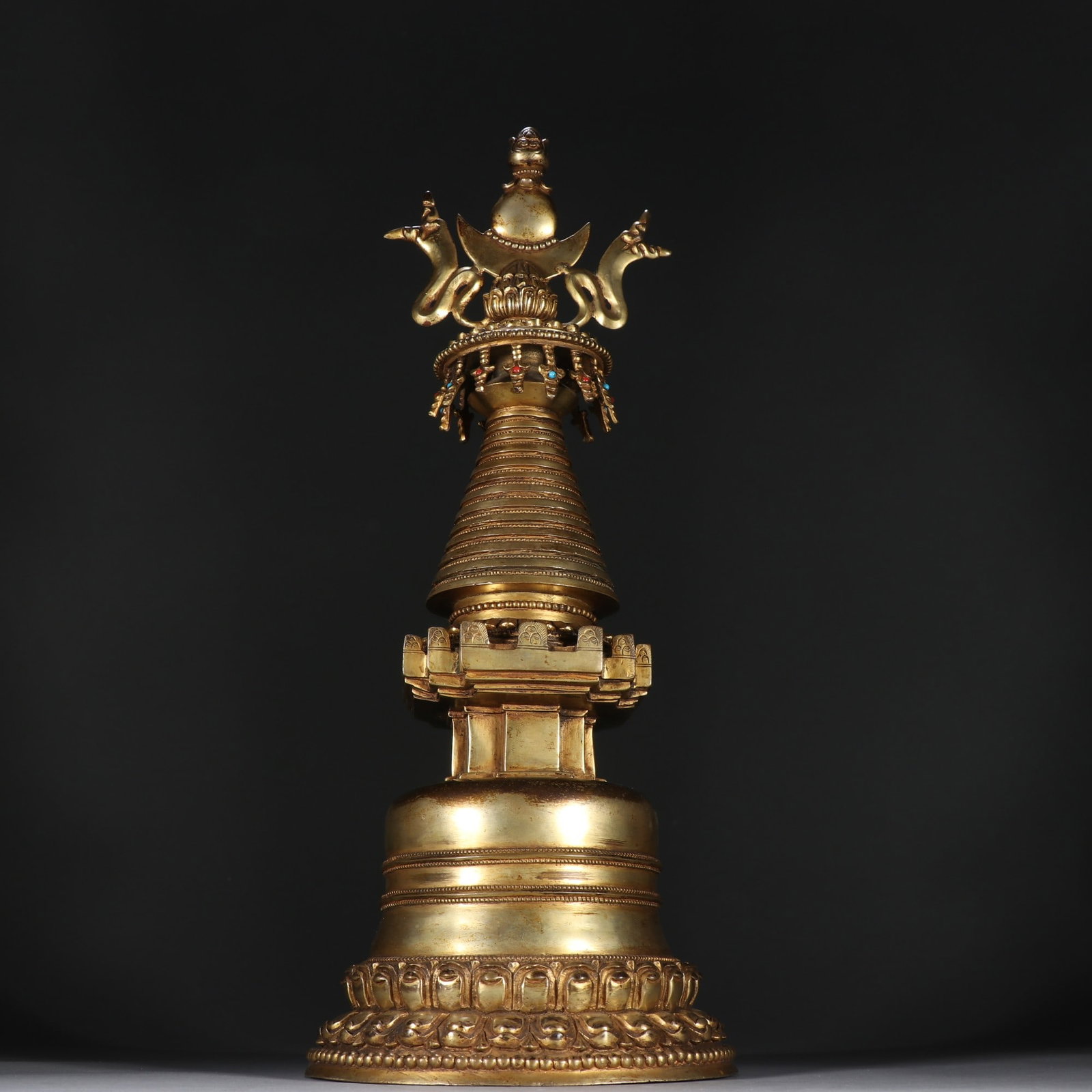 An Exquisite Gilt Bronze Inlaid Gems Pagoda: An Exquisite Gilt Bronze Inlaid Gems Pagoda Qing Dynasty, China Size:15inx5.7in Weight:3019.9g铜鎏金佛塔 中国清代 Size:38cmx14.5cm Weight:3019.9g