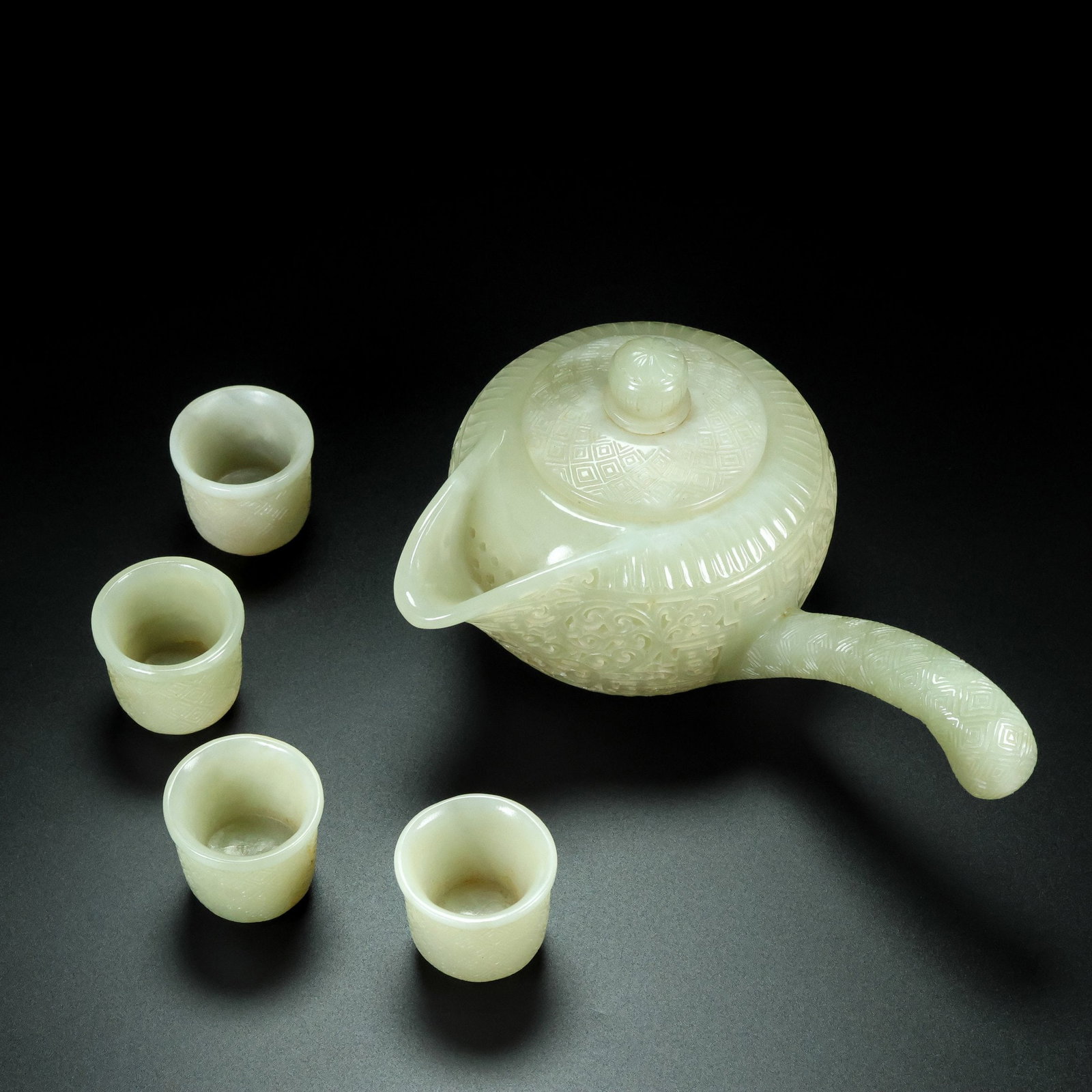 A Set of Fine White Jade Lotus Pattern Ewer Cup: A Set of Fine White Jade Lotus Pattern Ewer Cup Qing Dynasty, China Qianlong Four-character Mark Size:6.7inx3.9inx4.7in Size:1.3inx1.4in Total