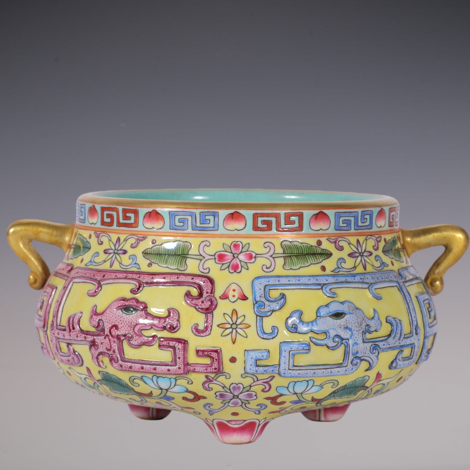 An Exquisite Enamel Lotus Pattern Dragon Pattern Double-Ears and Tripod Censer: An Exquisite Enamel Lotus Pattern Dragon Pattern Double-Ears and Tripod Censer Qing Dynasty, China Qianlong Six-character Mark Size:2.4inx3.7in珐琅彩黄地雕刻&