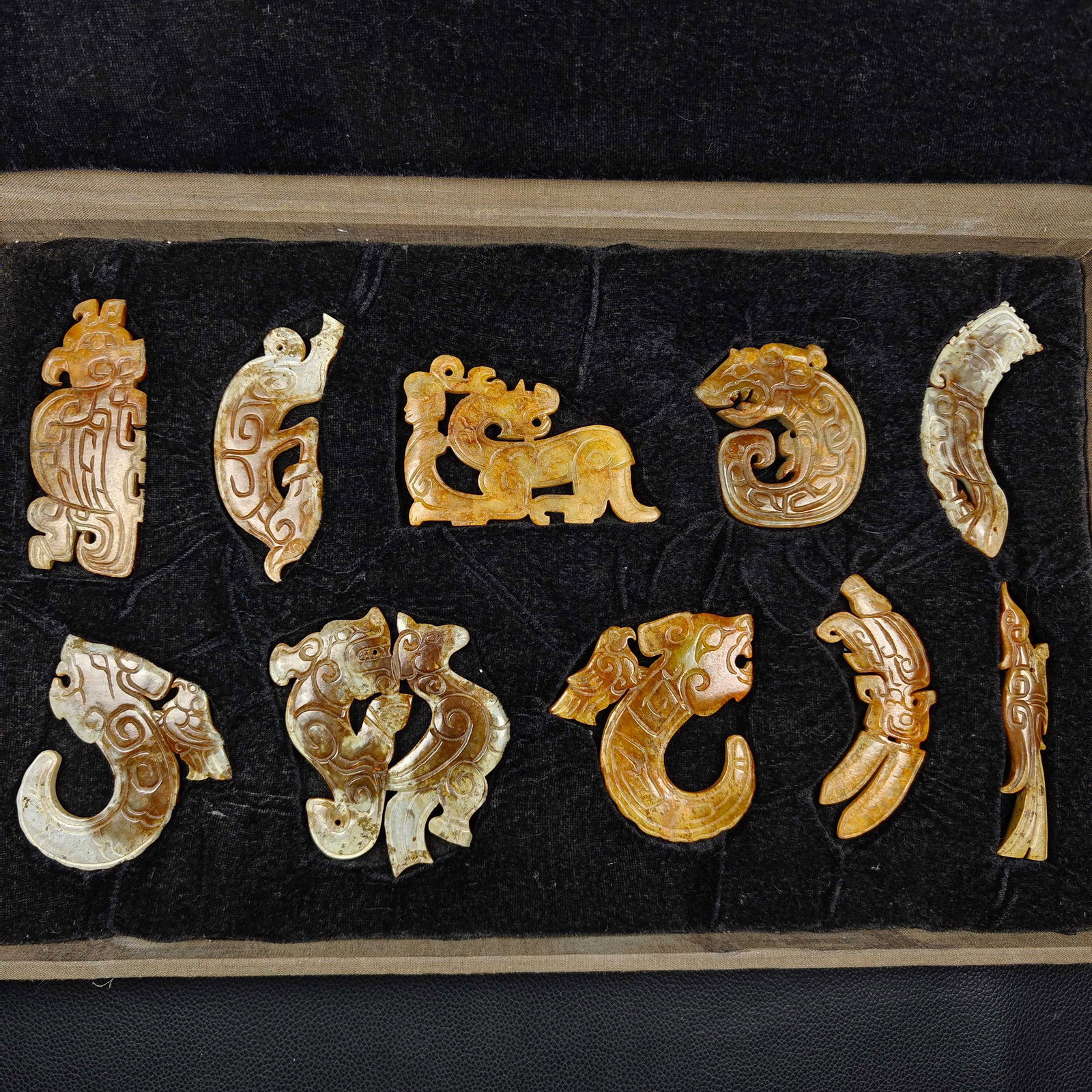 A Set of Fine White Jade With Inscription Auspicious Beast Ornament (1 of 9)