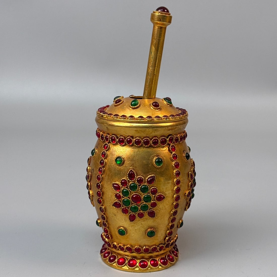 An Exquisite Gilt Bronze Inlaid Gems Jar: An Exquisite Gilt Bronze Inlaid Gems Jar Qing Dynasty, China Size:7.5inx3.5in Weight:805g铜鎏金多宝镶嵌捣药罐