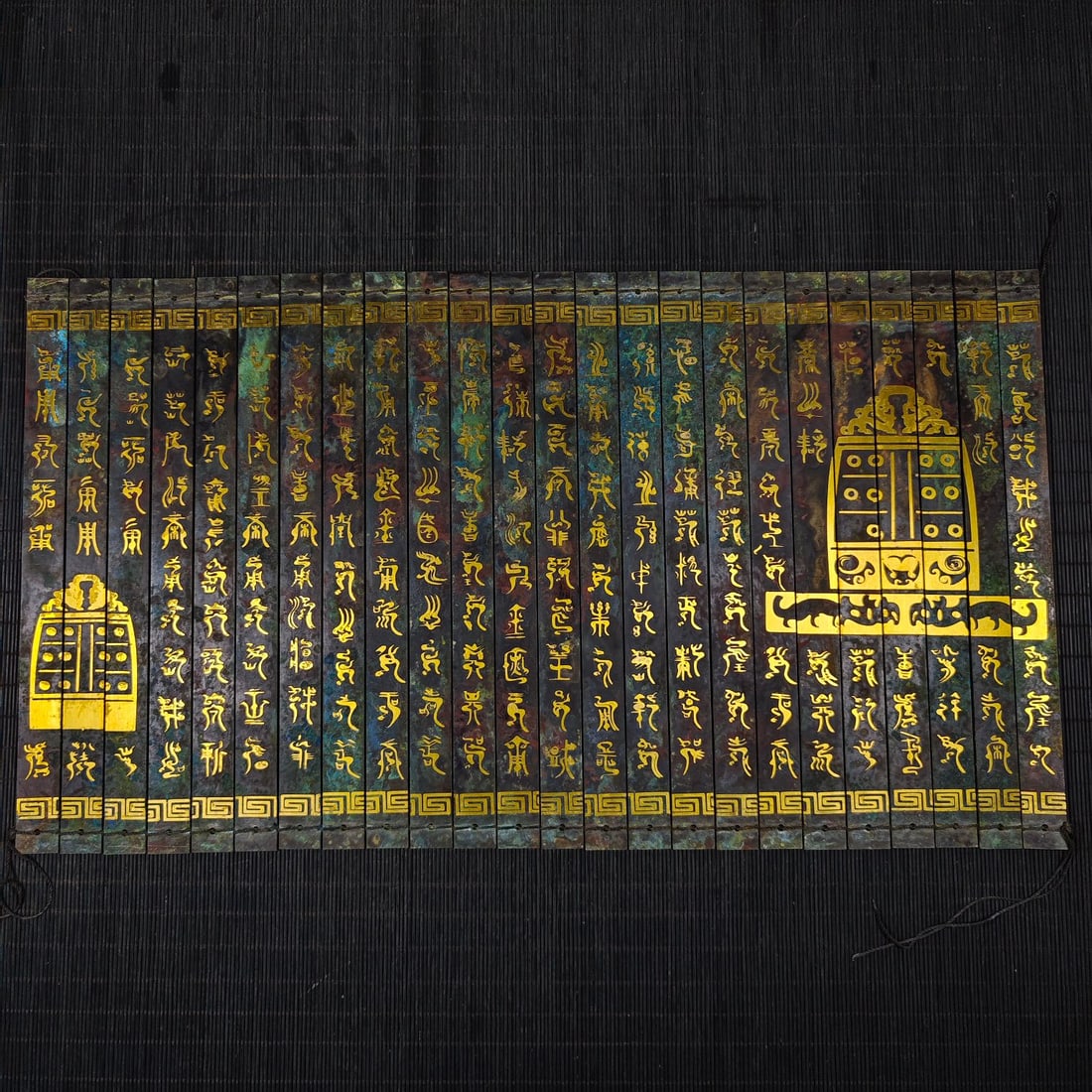 An Exquisite Bronze Inlaid Gold With Inscription Ornament: An Exquisite Bronze Inlaid Gold With Inscription Ornament the Warring States period in China Size:20.1inx11.2in Weight:1.6kg青铜错金铜竹片书笺 