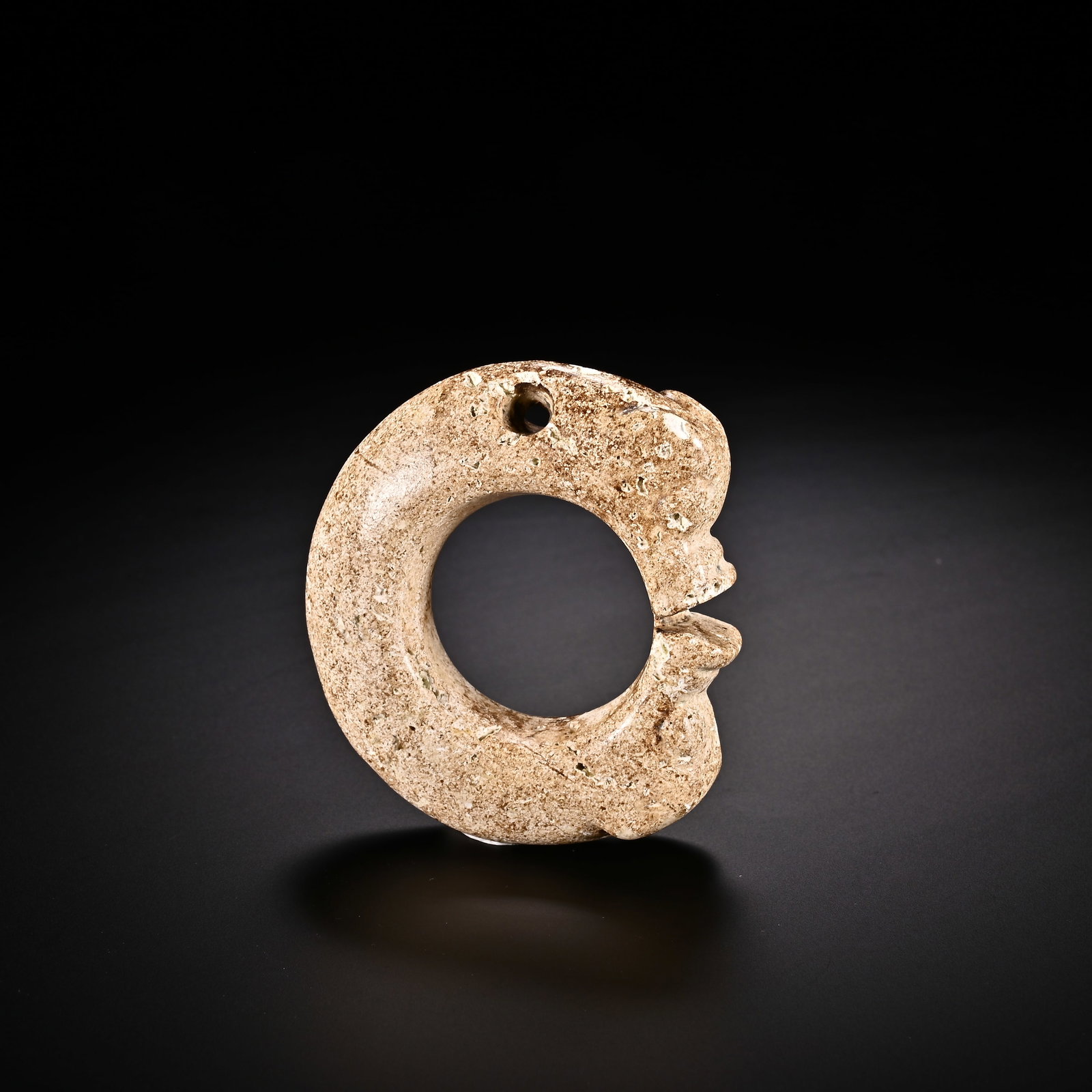 An Exquisite White Jade 'Boar& Dragon' Pendant: An Exquisite White Jade 'Boar& Dragon' Pendant Han Dynasty, China Size:2.1inx1.9in Weight:40g白玉猪龙挂件 中国汉代 Size:5.3cmx4.8cm Weight:4