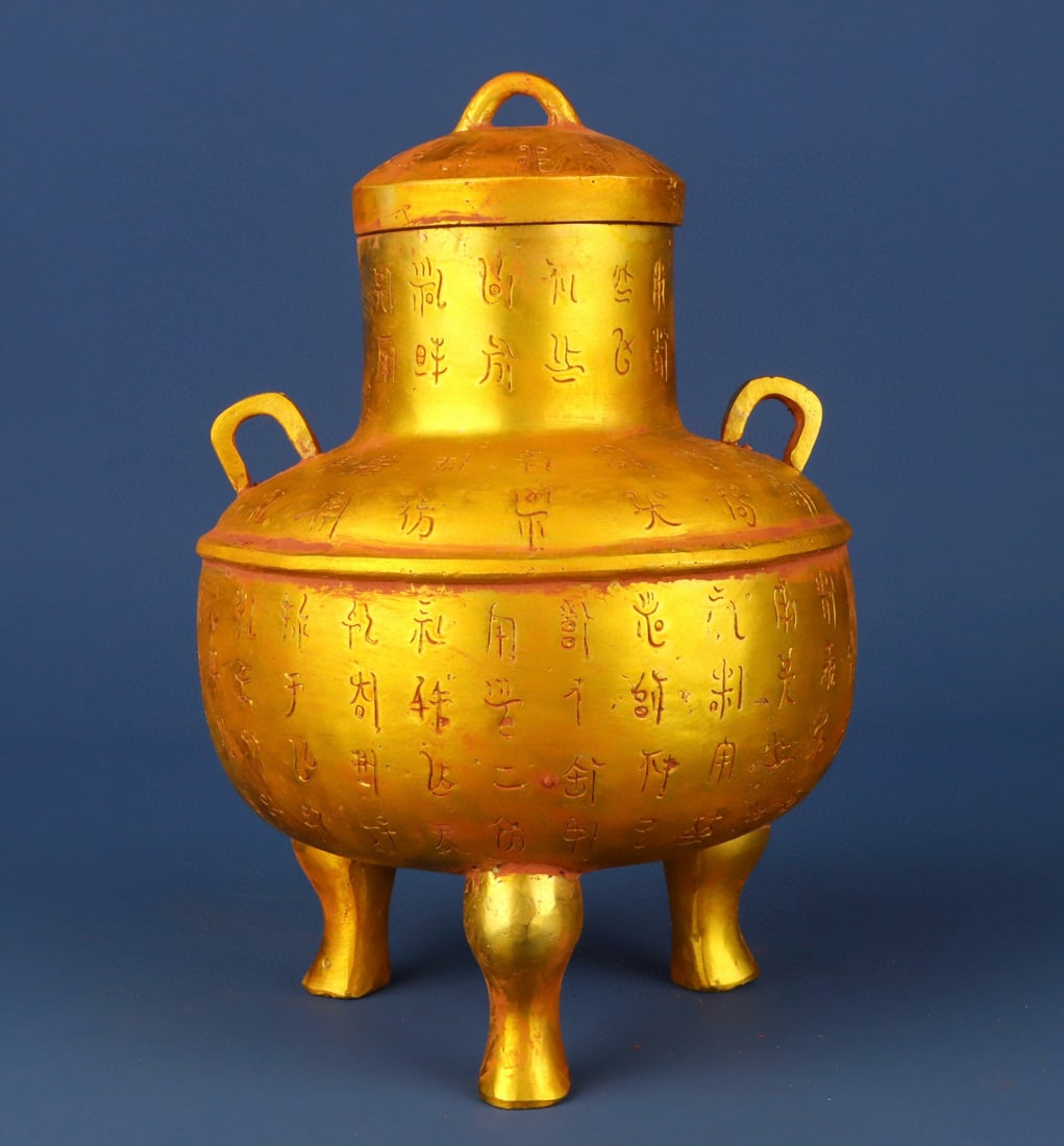 An Exquisite Gilt Bronze With Inscription Double-Ears and Tripod Jar: An Exquisite Gilt Bronze With Inscription Double-Ears and Tripod Jar Han Dynasty, China Size:7.5inx9.4in Weight:1950g铜鎏金铭文三足罐 中国&#