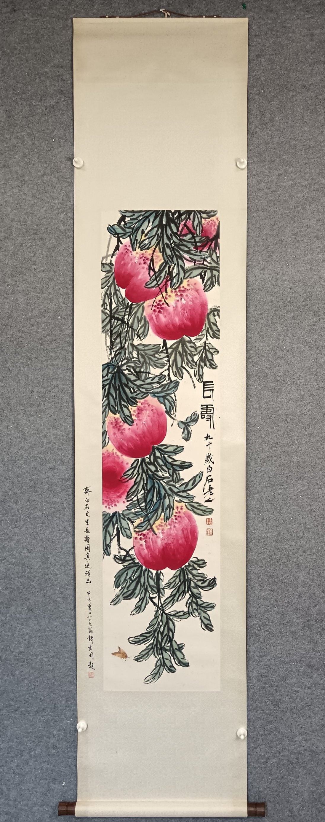 A Chinese Vertical Scroll Ink Painting of Flower and Fruit on Paper: A Chinese Vertical Scroll Ink Painting of Flower and Fruit on Paper Qi baishi Without frame Size:13.4inx54.3in齐白石寿桃 纸本立轴Without frame Siz