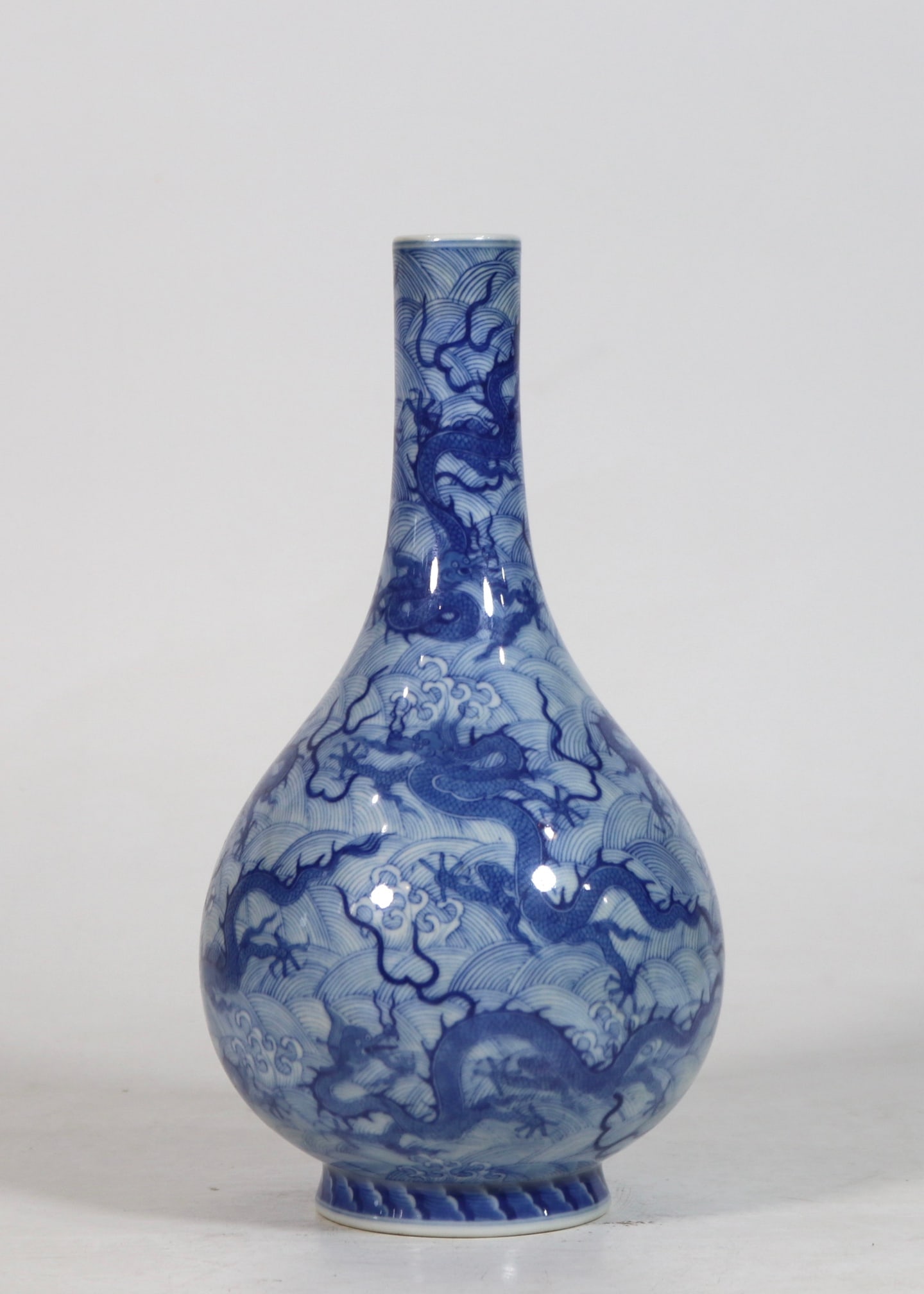 An Exquisite Blue and White Seawater Pattern Dragon Pattern Vase: An Exquisite Blue and White Seawater Pattern Dragon Pattern Vase Qing Dynasty, China Yongzheng Six-character Mark Size:10.1inx5.1in青花海水九龙胆瓶 