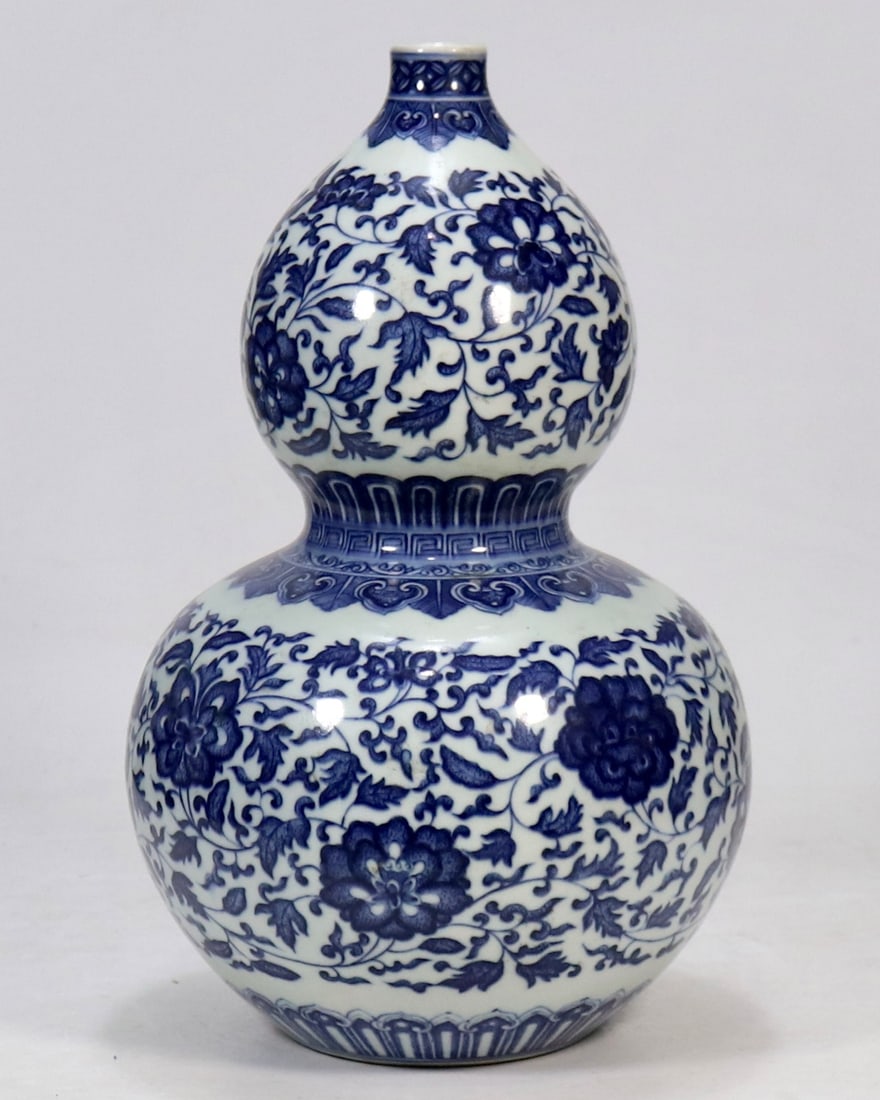 An Exquisite Blue and White Lotus Pattern Gourd-Shaped Vase: An Exquisite Blue and White Lotus Pattern Gourd-Shaped Vase Qing Dynasty, China Qianlong Six-character Mark Size:13.8in青花缠枝莲纹葫芦瓶 中