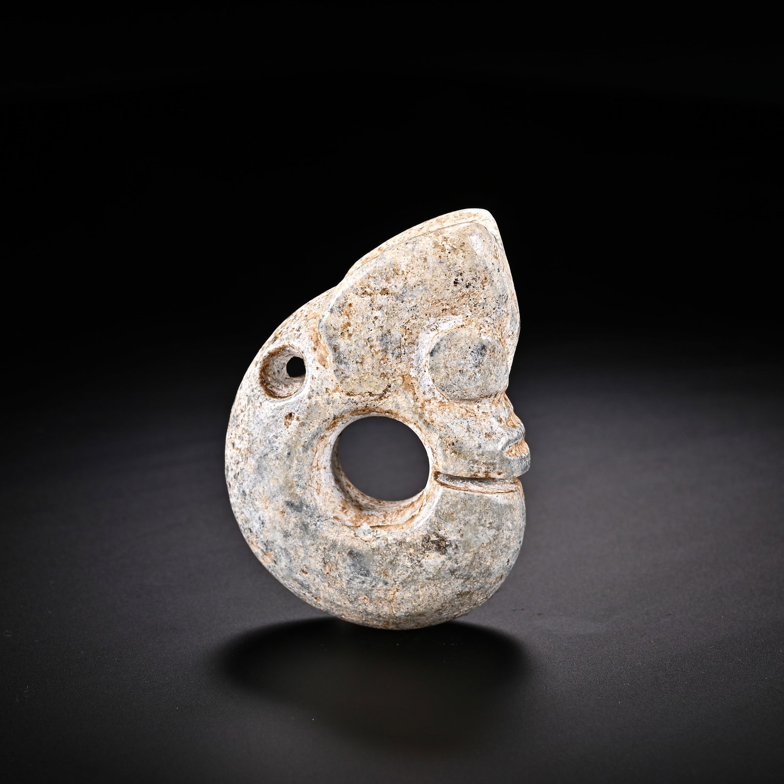 An Exquisite White Jade 'Boar& Dragon' Pendant: An Exquisite White Jade 'Boar& Dragon' Pendant Han Dynasty, China Size:2.1inx1.5in Weight:50g白玉猪龙挂件 中国汉代 Size:5.4cmx3.8cm Weight:5