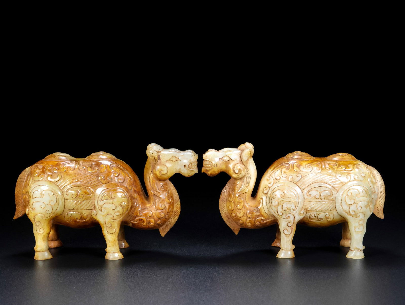 A Pair of Exquisite White Jade Camel Ornament: A Pair of Exquisite White Jade Camel Ornament Qing Dynasty, China Size:5.5inx3.5inx2.4in Total Weight:1242g白玉骆驼一对 中国清代 Size:14cmx9
