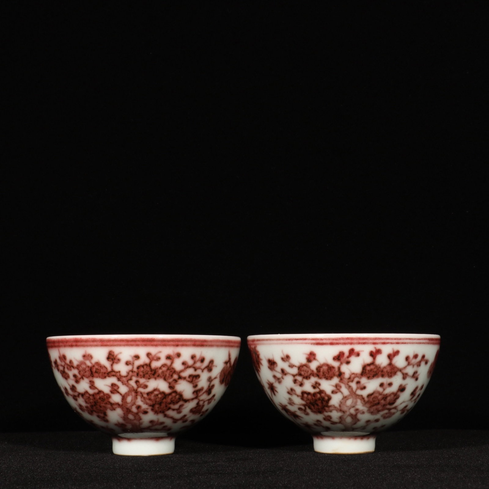 A Pair of Exquisite Underglaze-Red Pine, Bamboo and Plum Blossom Pattern Cups: A Pair of Exquisite Underglaze-Red Pine,Bamboo and Plum Blossom Pattern Cups,Ming Dynasty,China,Yongle Four-character Mark,Size:2.2inx4.1in 一对釉里红松竹