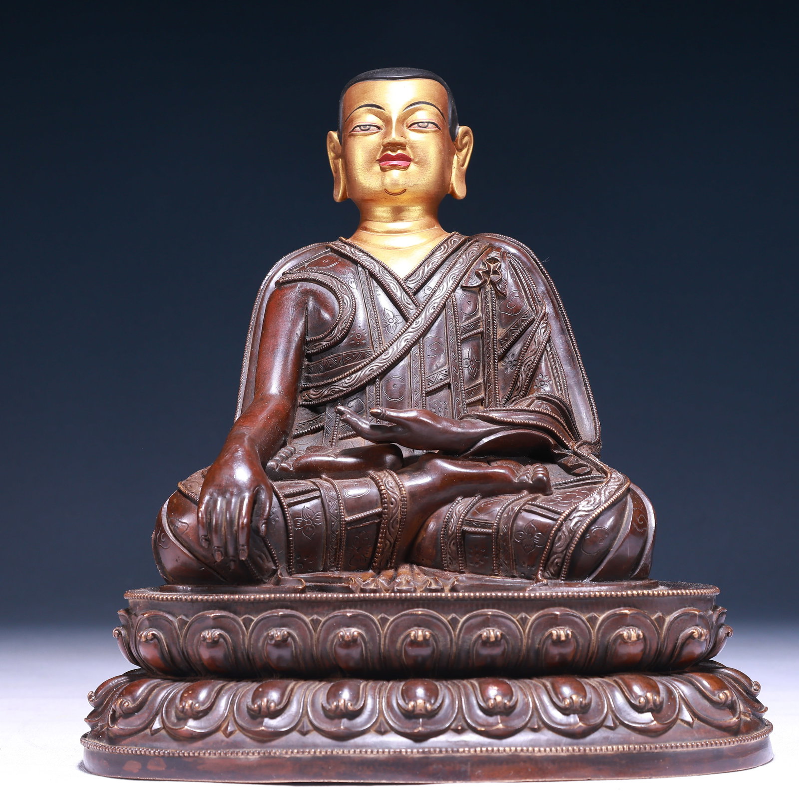 A Solemn Gilt Bronze Statue of Guru,With Inscription: A Solemn Gilt Bronze Statue of Guru,With Inscription,Qing Dynasty,China,Size:8.7inx5.5inx10.2in,Weight:4450g 铜鎏金上师像,带铭文,中国&