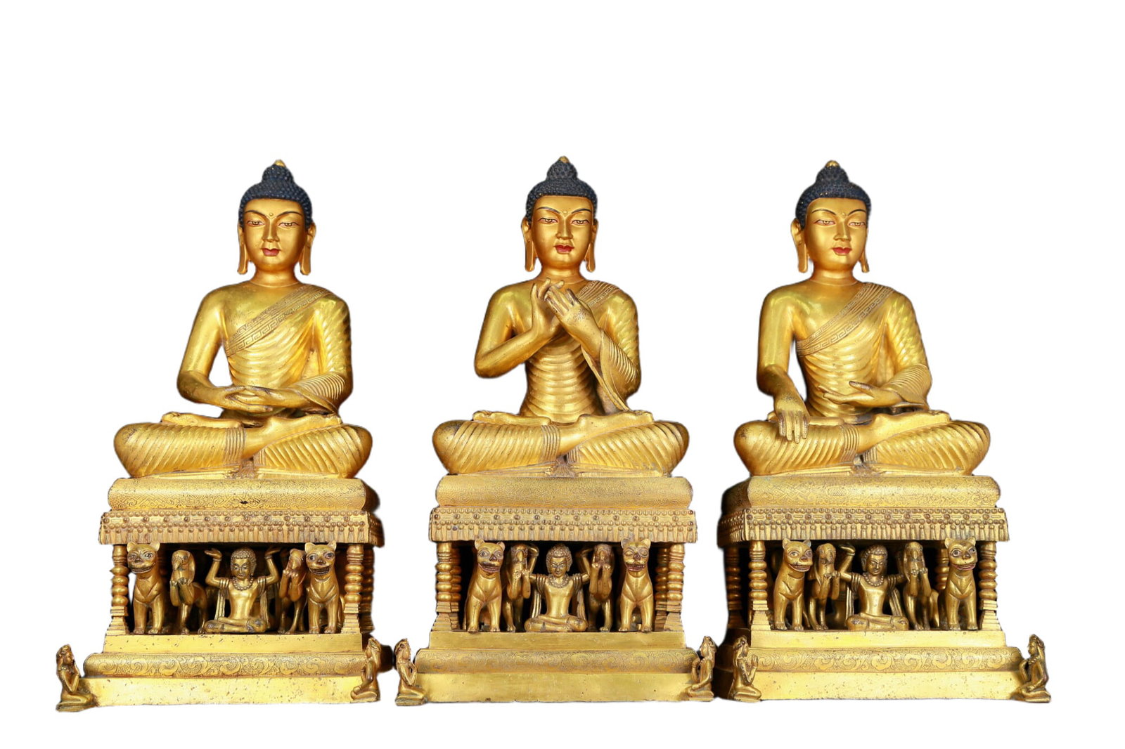 A group of huge gilt bronze statues of Sakyamuni: set of huge gilt bronze statues of Sakyamuni, Ming Dynasty, China. The Buddha's face has a calm, kind and serene expression, and his hands and fingers show beautiful lines and proportions to