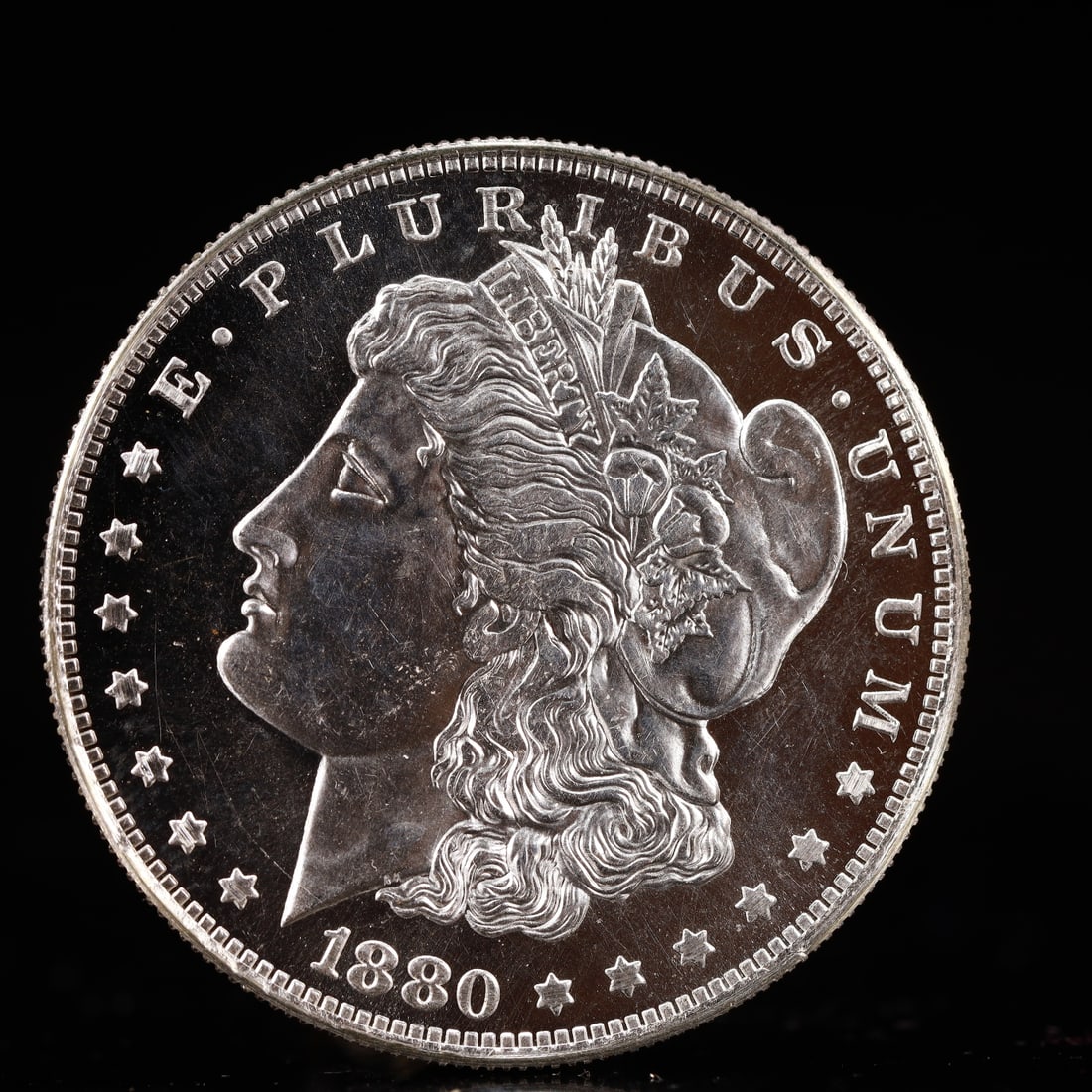 USA Morgan Dollar 1880 Coin: Obv: profile bust with date below and E PLURIBUS UNUM legend and stars around. Rev: eagle with In God we trust above within wreath with UNITED STATES OF AMERICA ONE DOLLAR legend. IN GOD WE TRUST /