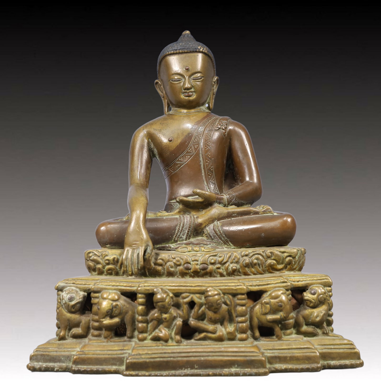A Solemn Gilt Bronze Statue of Sakyamuni, With Inscription: A Solemn Gilt Bronze Statue of Sakyamuni, With Inscription, Qing Dynasty, China, Size:9.1inx6.3inx10.6in, Weight:4950g 铜鎏金释迦摩尼像,带铭