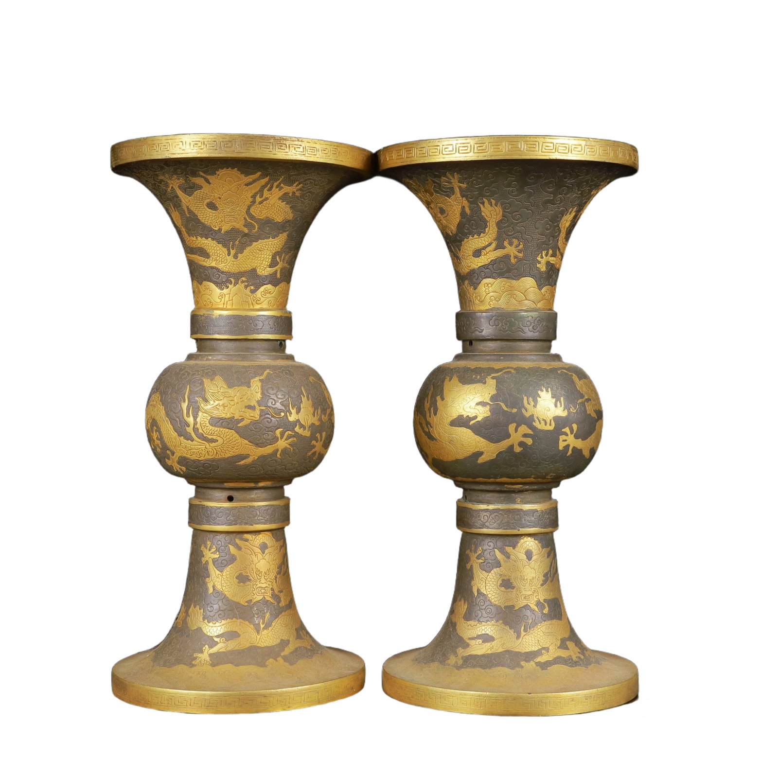A Pair of Exquisite Gilt Silver Dragon Pattern Vases: A Pair of Exquisite Gilt Silver Dragon Pattern Vases,Tang Dynasty,China,Zhenguan Four-Character Mark,Size:5.5inx11in*2,Weight:2750g 一对银鎏金龙纹瓶,