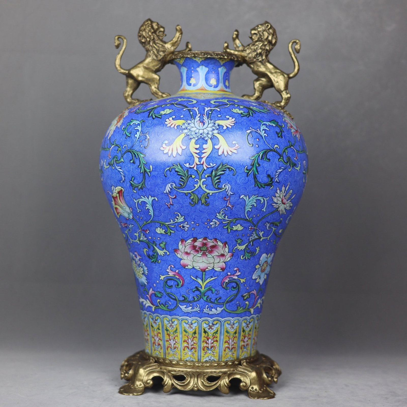 A Huge Blue Ground Famille-Rose Inlaid Bronze Lotus Pattern Lion-Ears Vase: A Huge Blue Ground Famille-Rose Inlaid Bronze Lotus Pattern Lion-Ears Vase,Qing Dynasty,China,Qianlong Four-character Mark,Size:19.3inx9.8in 蓝地粉彩镶铜缠