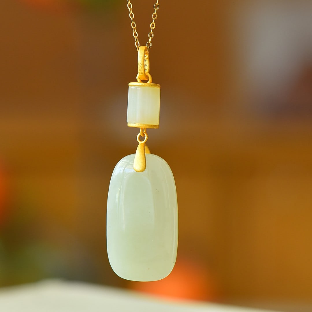 An Exquisite Sterling Silver-Gold Plated Inlaid White Jade Pendant: An Exquisite Sterling Silver-Gold Plated Inlaid White Jade Pendant,Size:0.7inx1.2in 纯银镀金镶白玉吊坠