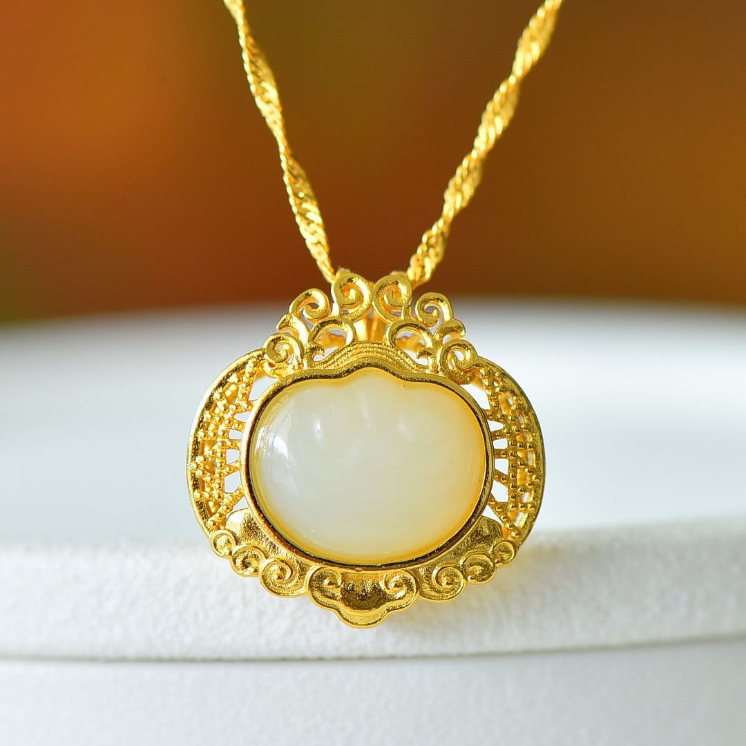 An Exquisite Sterling Silver-Gold Plated Inlaid White Jade Pendant: An Exquisite Sterling Silver-Gold Plated Inlaid White Jade Pendant 纯银镀金镶白玉吊坠