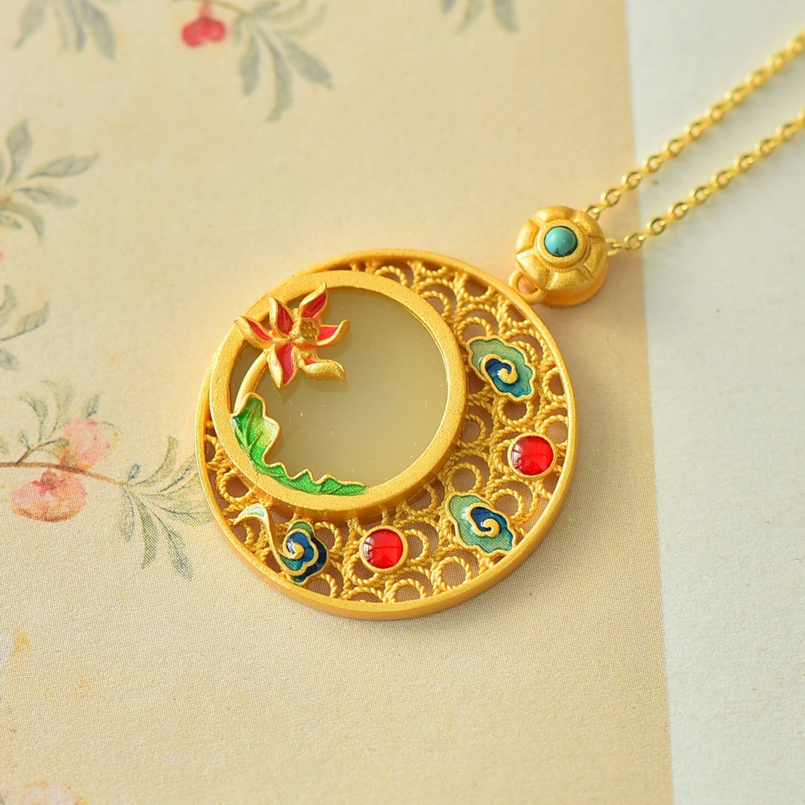 An Exquisite Sterling Silver-Gold Plated Inlaid White Jade Pendant: Estimated Value:300-600 An Exquisite Sterling Silver-Gold Plated Inlaid White Jade Pendant 纯银镀金镶白玉吊坠
